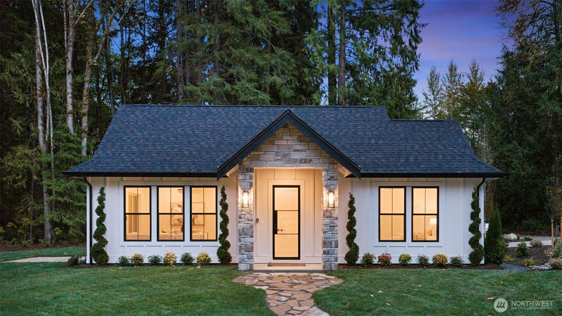 Thoughtfully designed for versatility and luxury, the property showcases a separate cottage with its own garage -ideal for multi-generational living, guests, or income potential.