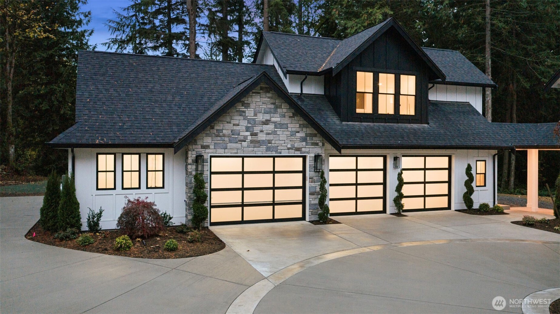 A four-car garage includes an oversized bay fit for a boat or workshop, while ample RV parking and manicured surroundings create a rare blend of function and refinement.