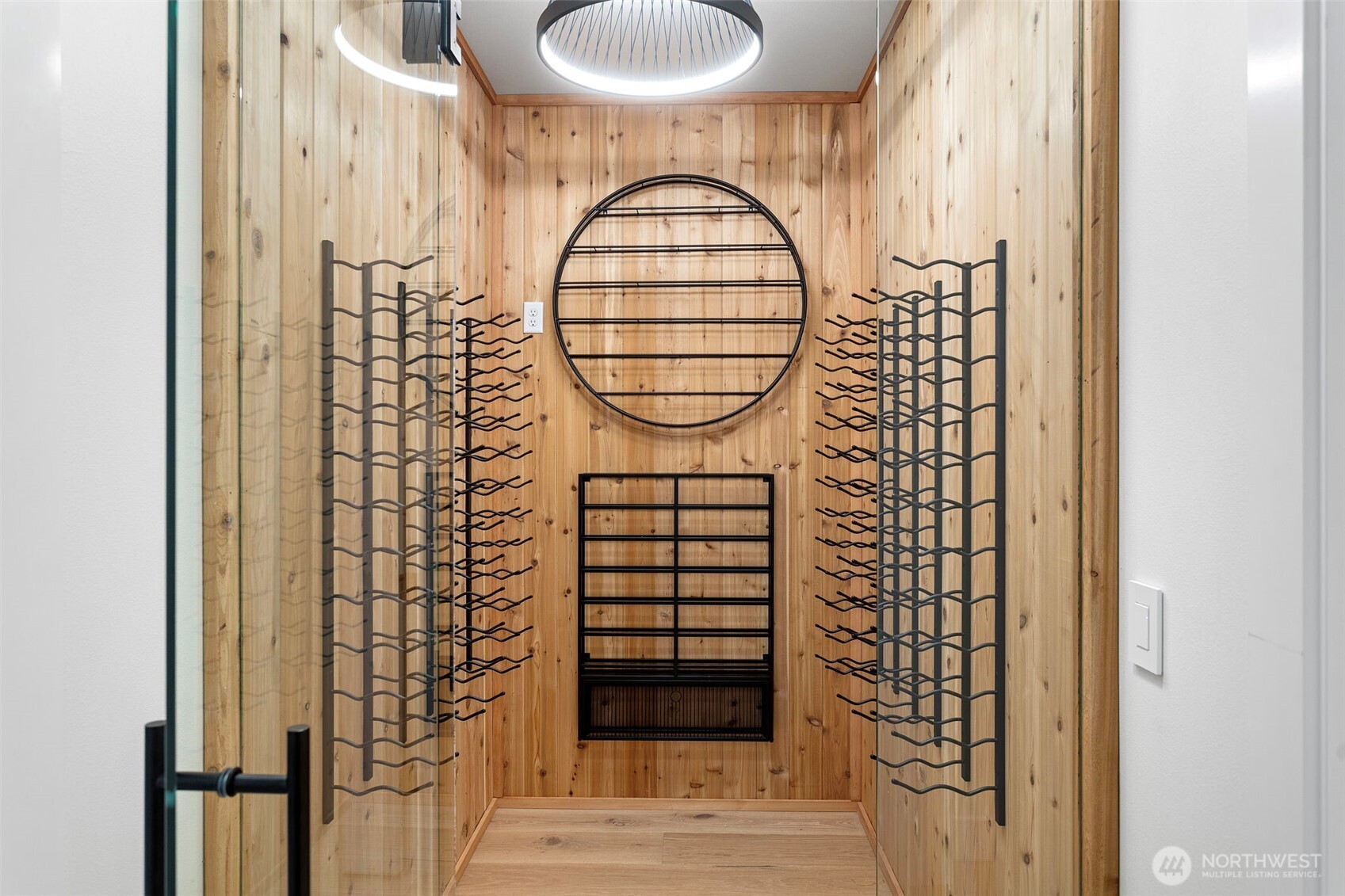 Temperature-controlled cedar wine room designed for the true collector, featuring custom shelving for over 150 bottles with additional space for future additions—combining function, craftsmanship, and timeless appeal.