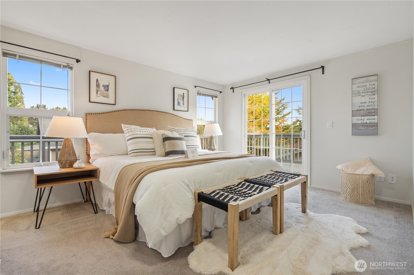 Primary bedroom with large windows