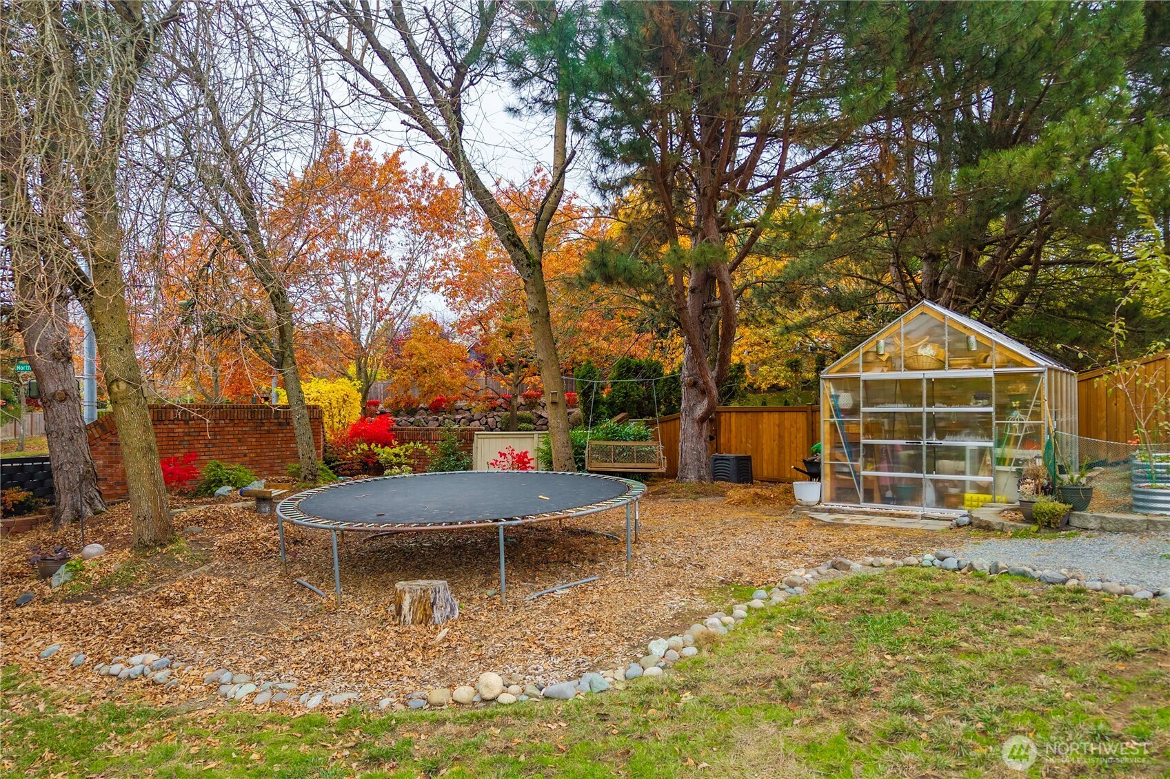 Stunning fall foliage shows the beauty of this backyard oasis!
