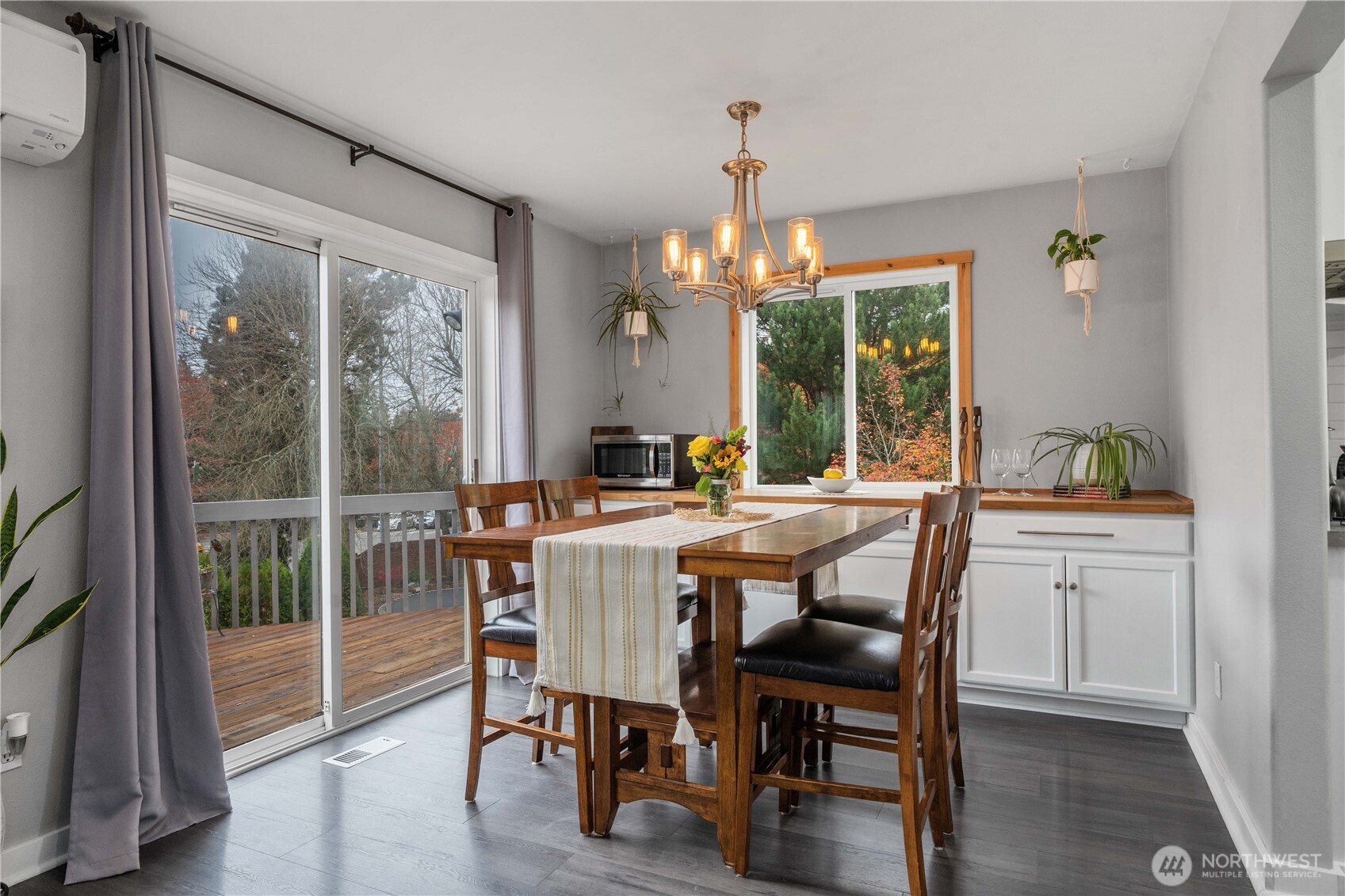 Dining with direct access to the back deck, sits off the kitchen and living.