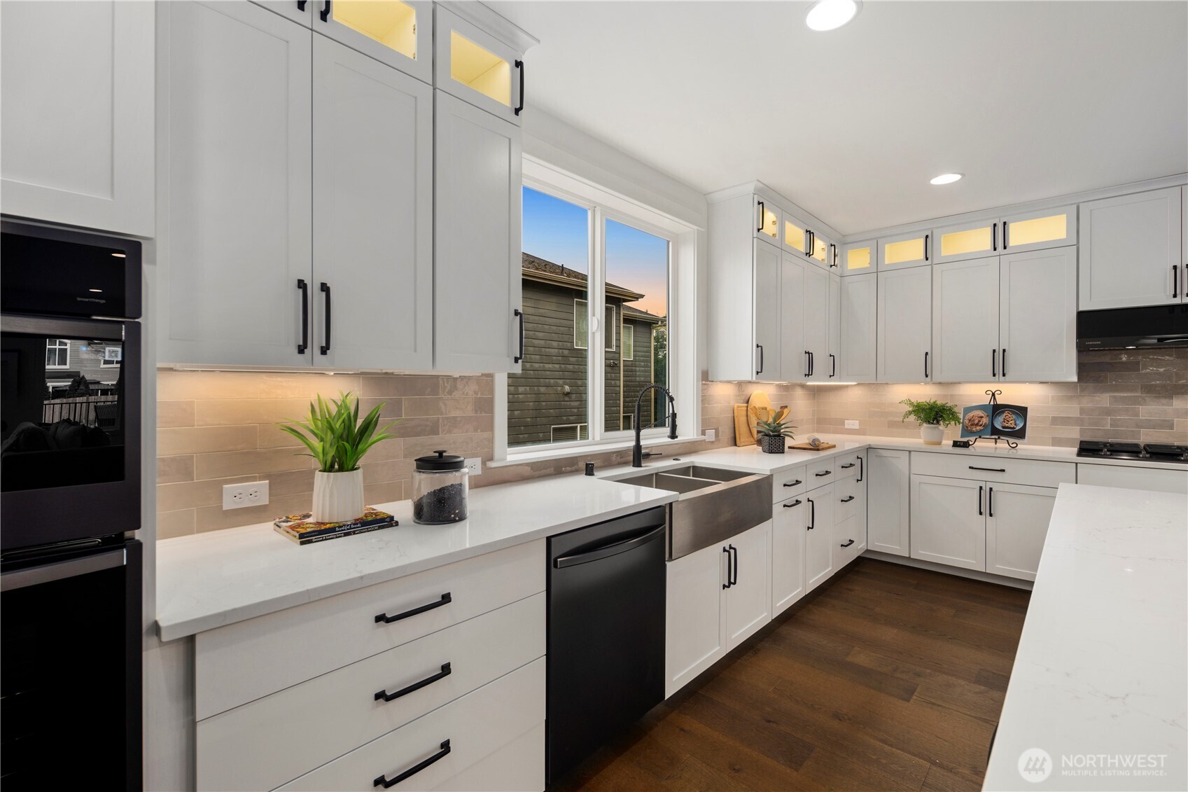 Kitchen with Farmhouse Sink: Oversized window frames a deep farmhouse sink, filling the space with natural light. Functional elegance combines with thoughtful design, ideal for both daily use and entertaining.    Photos are from THIS model home at Foxmoore but are for visualization purposes only.