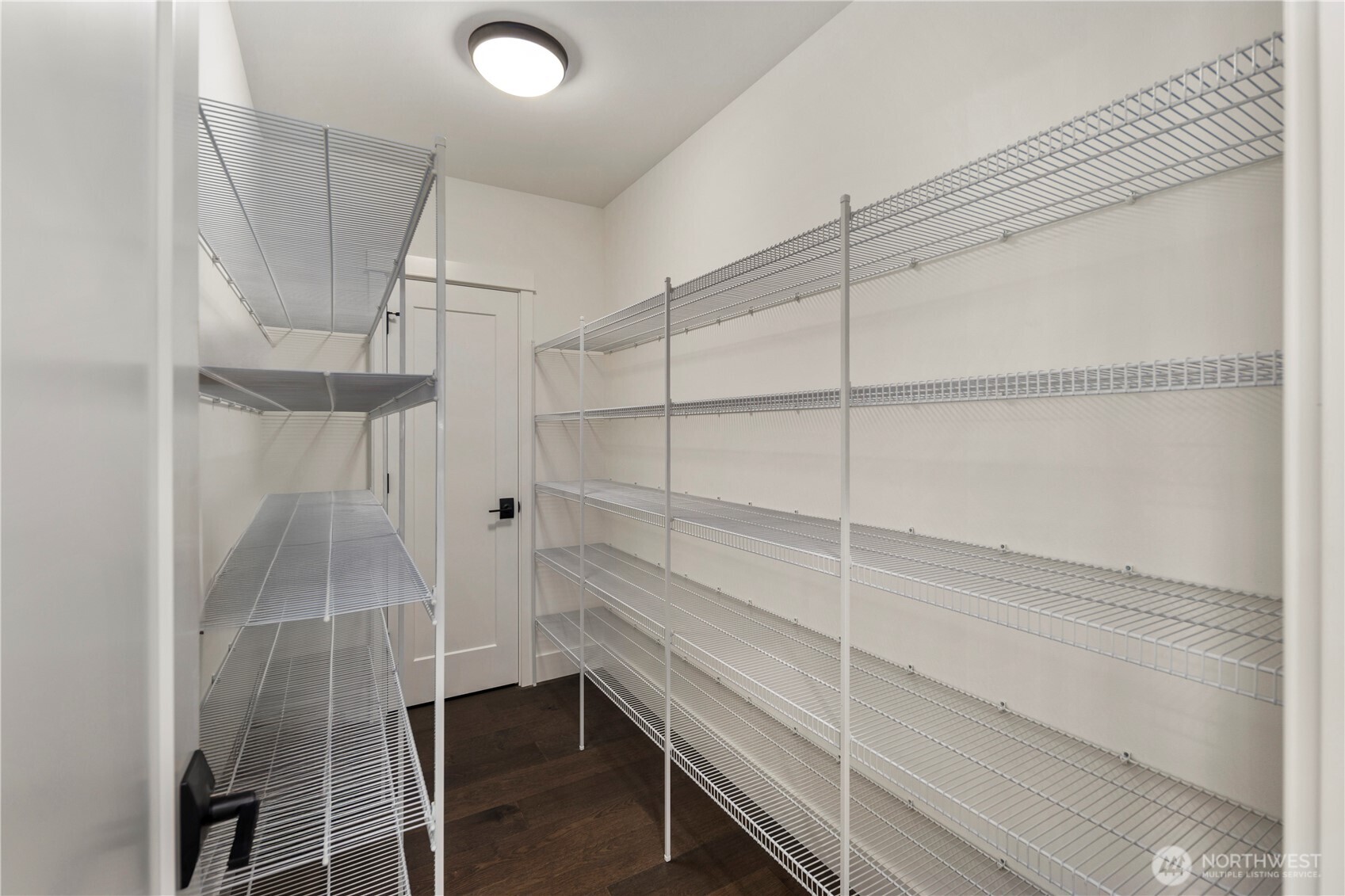 Walk-In Pantry: Spacious walk-in pantry with extensive shelving offers ample storage for bulk items and appliances. A true entertainer’s delight, it keeps the kitchen uncluttered and organized.    Photos are from THIS model home at Foxmoore but are for visualization purposes only.