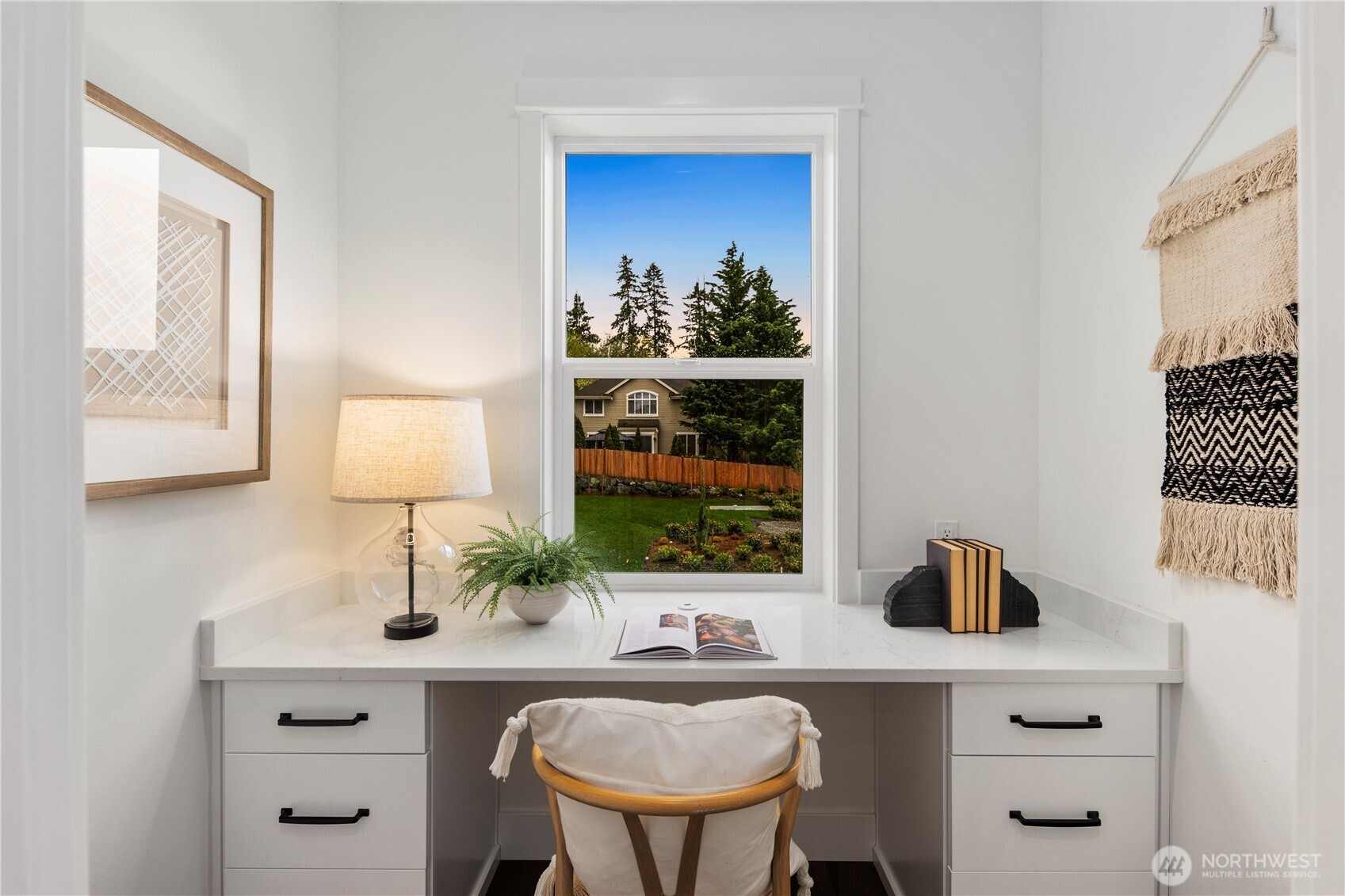 Pocket Office: Light-filled pocket office overlooks the front of the home, creating a peaceful spot for remote work or homework. Built-in desk and storage keep the space functional without interrupting the flow of the main level.    Photos are from THIS model home at Foxmoore but are for visualization purposes only.