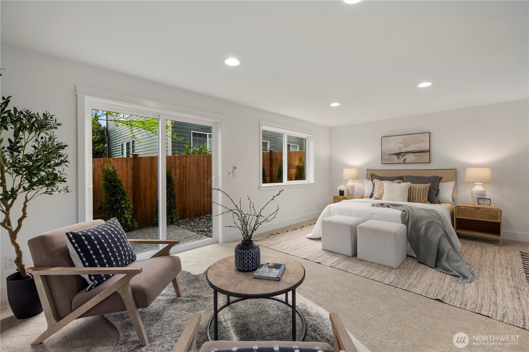 Lower-Level Bedroom or Bonus Suite: Expansive lower-level suite with multiple windows and direct patio access offers flexibility for use as a private guest retreat, media room, or home office. The generous layout provides comfort and convenience with endless possibilities for customization.    Photos are from THIS model home at Foxmoore but are for visualization purposes only.