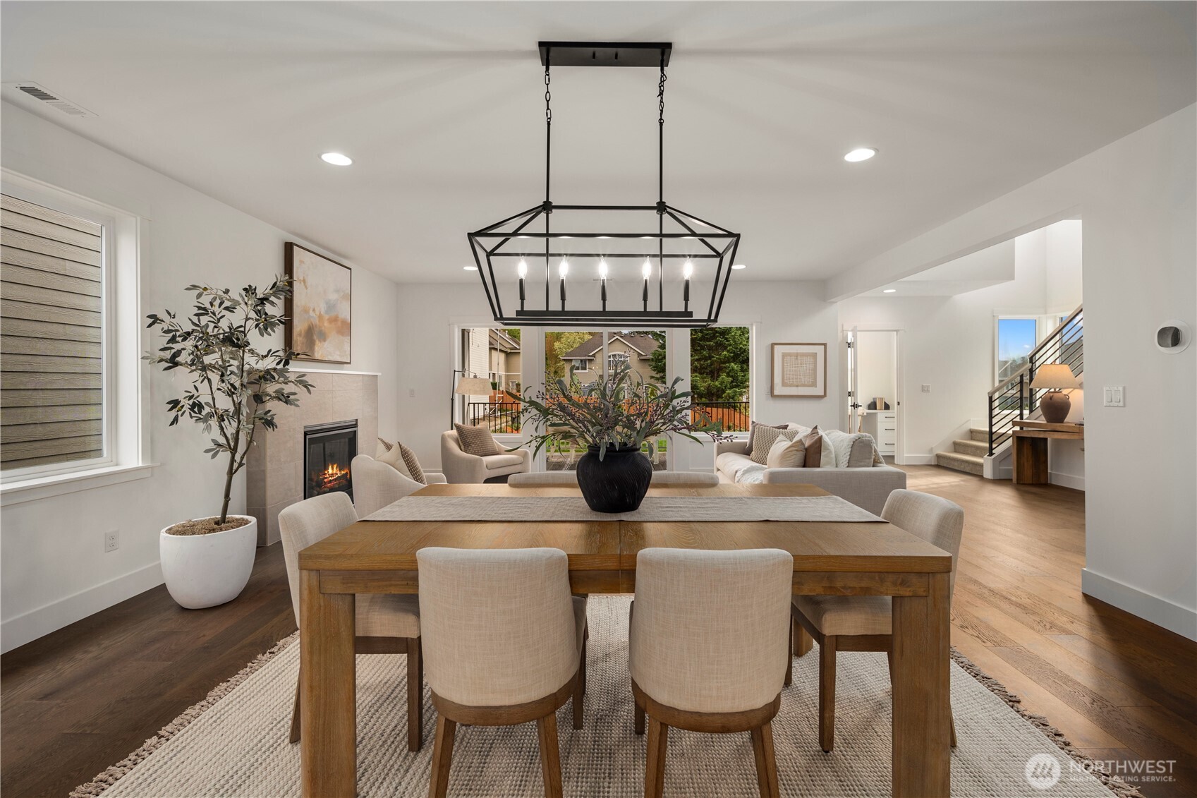 Dining to Great Room View: Thoughtfully designed open-concept plan unites dining and living areas with stylish finishes and abundant light. This inviting flow allows for both intimate dinners and lively gatherings with ease.    Photos are from THIS model home at Foxmoore but are for visualization purposes only.