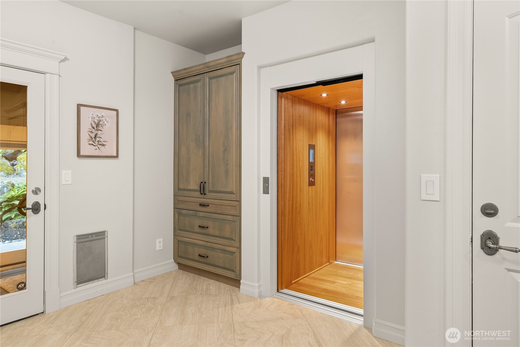 A Brazilian cherry wrapped elevator takes you between the garage, main and upper floors.