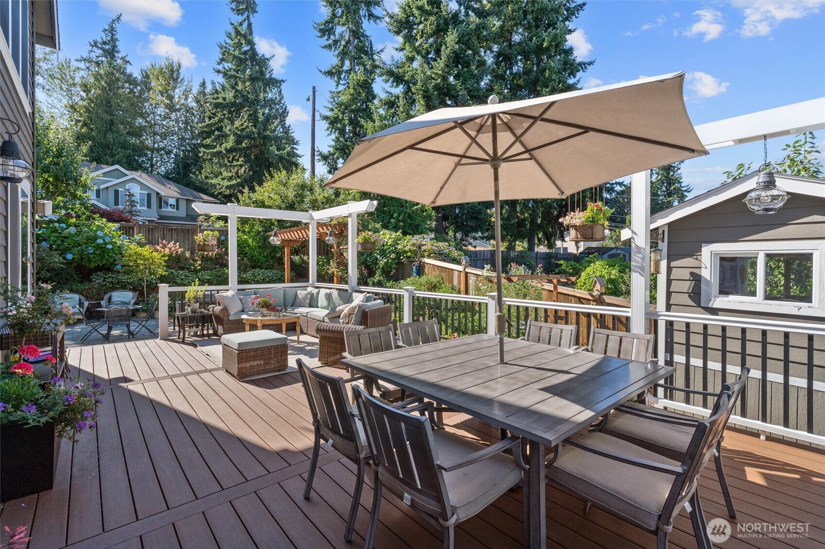 Enjoy the peaceful yard with 32X16 Azek deck & TimberTech railing, water features, arbor, automatic irrigation line drip, outbuilding with kid’s play fort and storage.