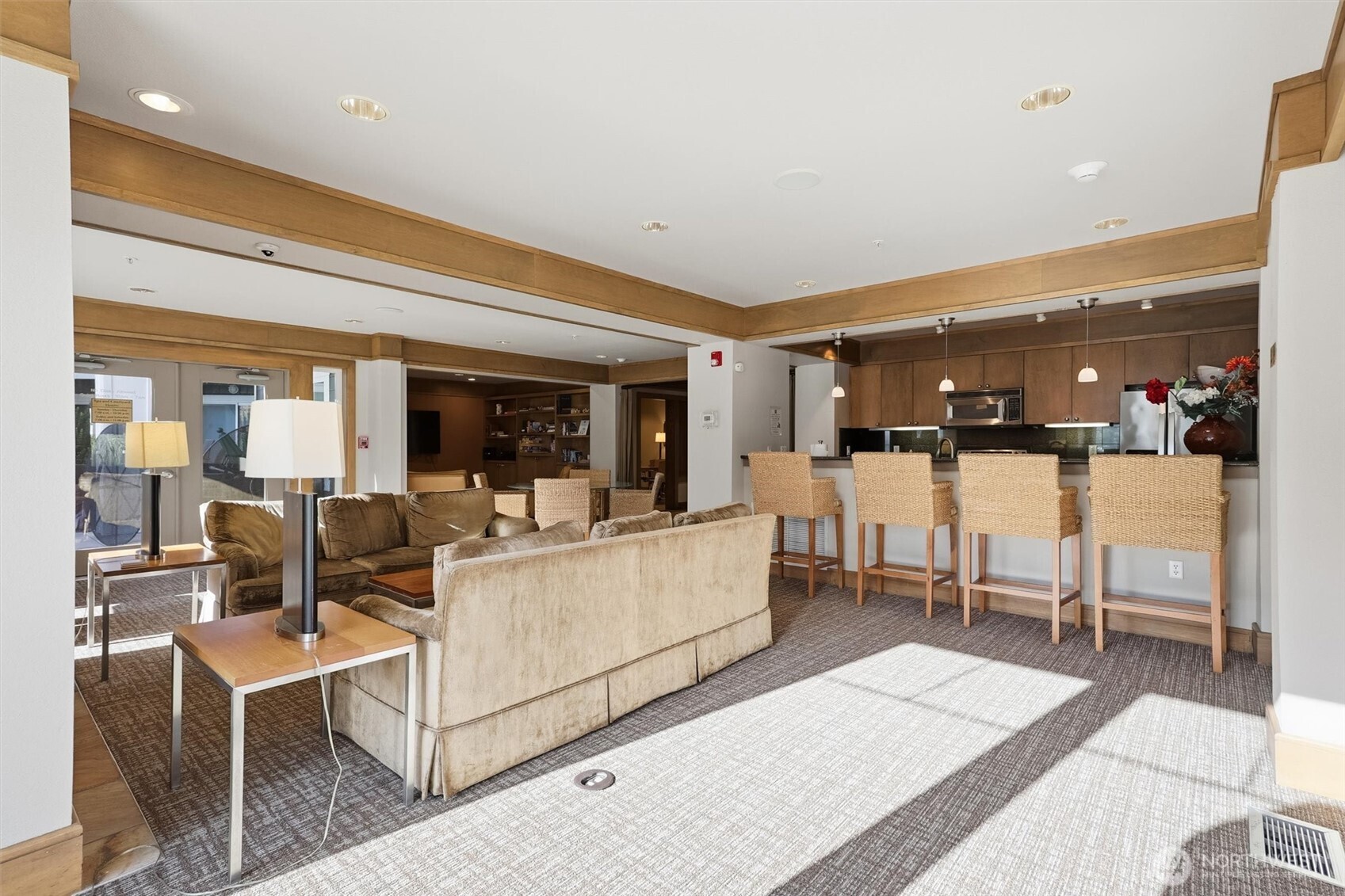 Ballard Place lounge with full kitchen and comfortable seating.