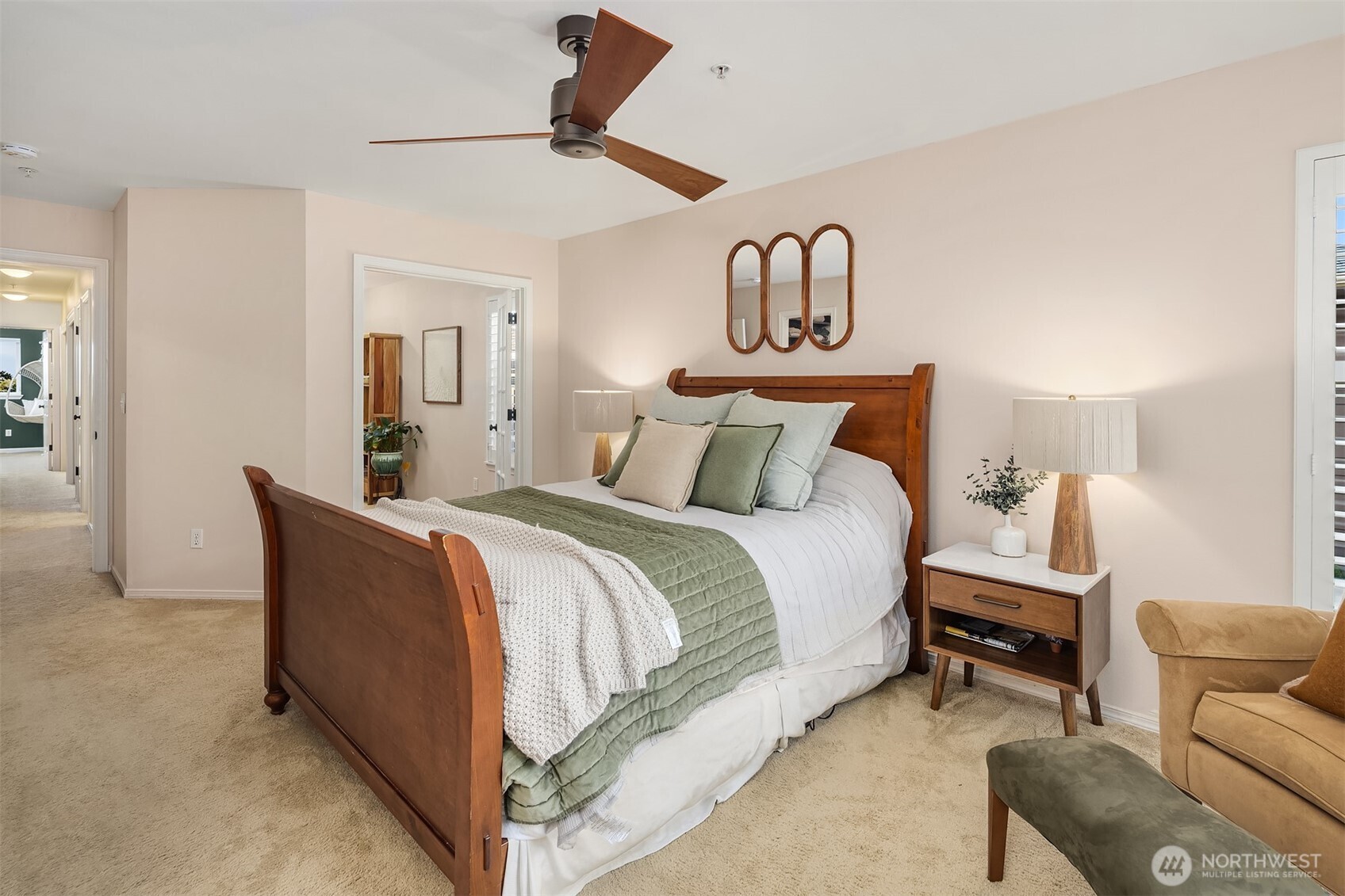 This amply-sized primary bedroom includes a spacious walk-in closet (not pictured).