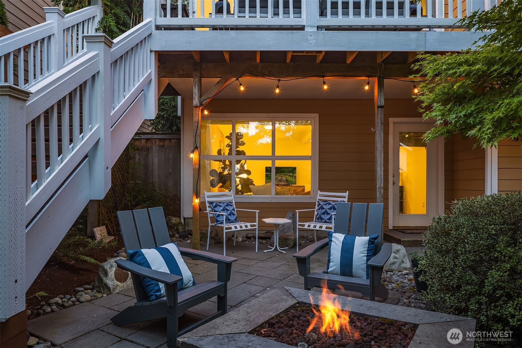 The owners extended the main floor deck to span the length of the home and added stairs down to the back yard.