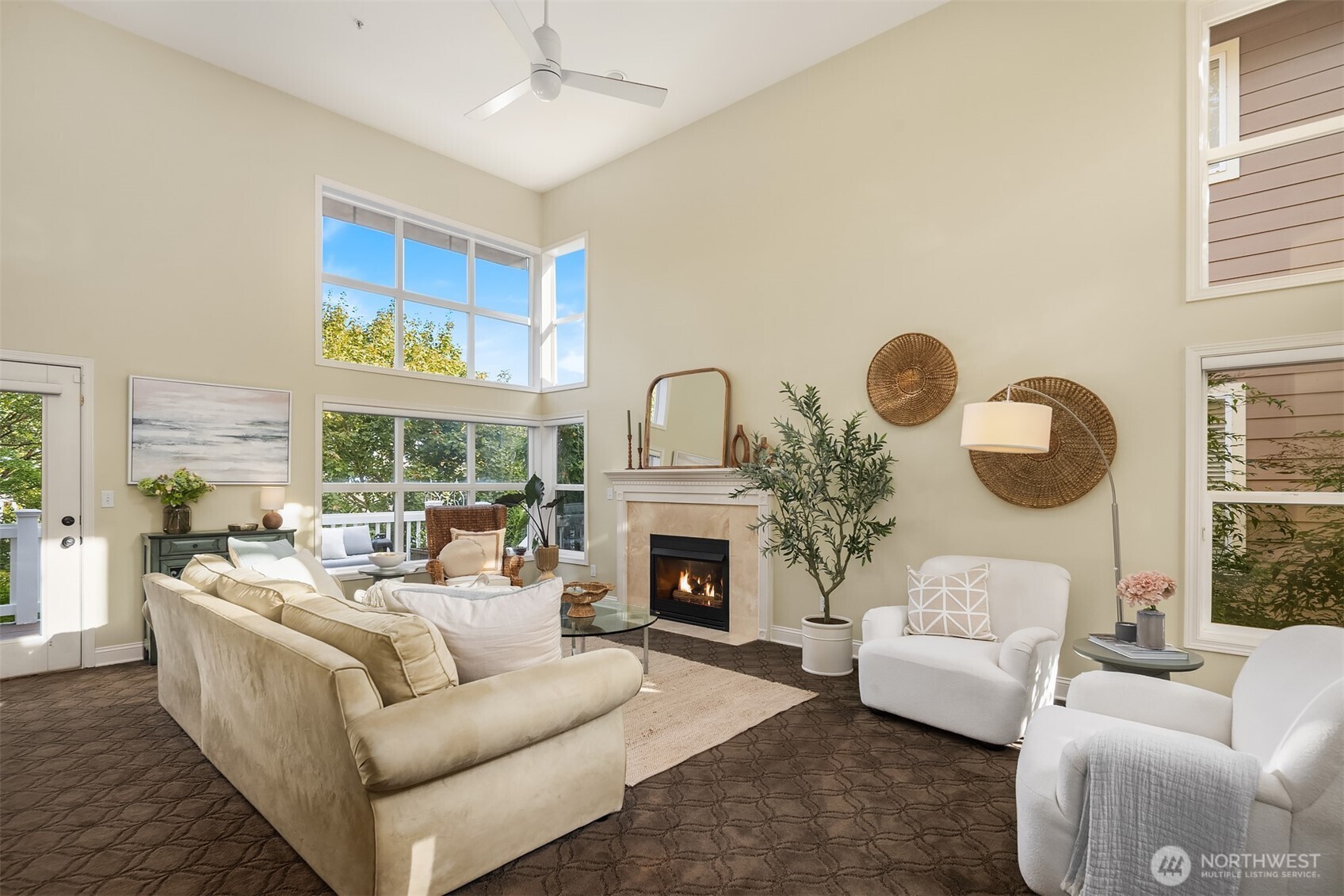 Windows abound on this light-filled main floor at all times of day. A gas fireplace at the heart of this main floor living space.