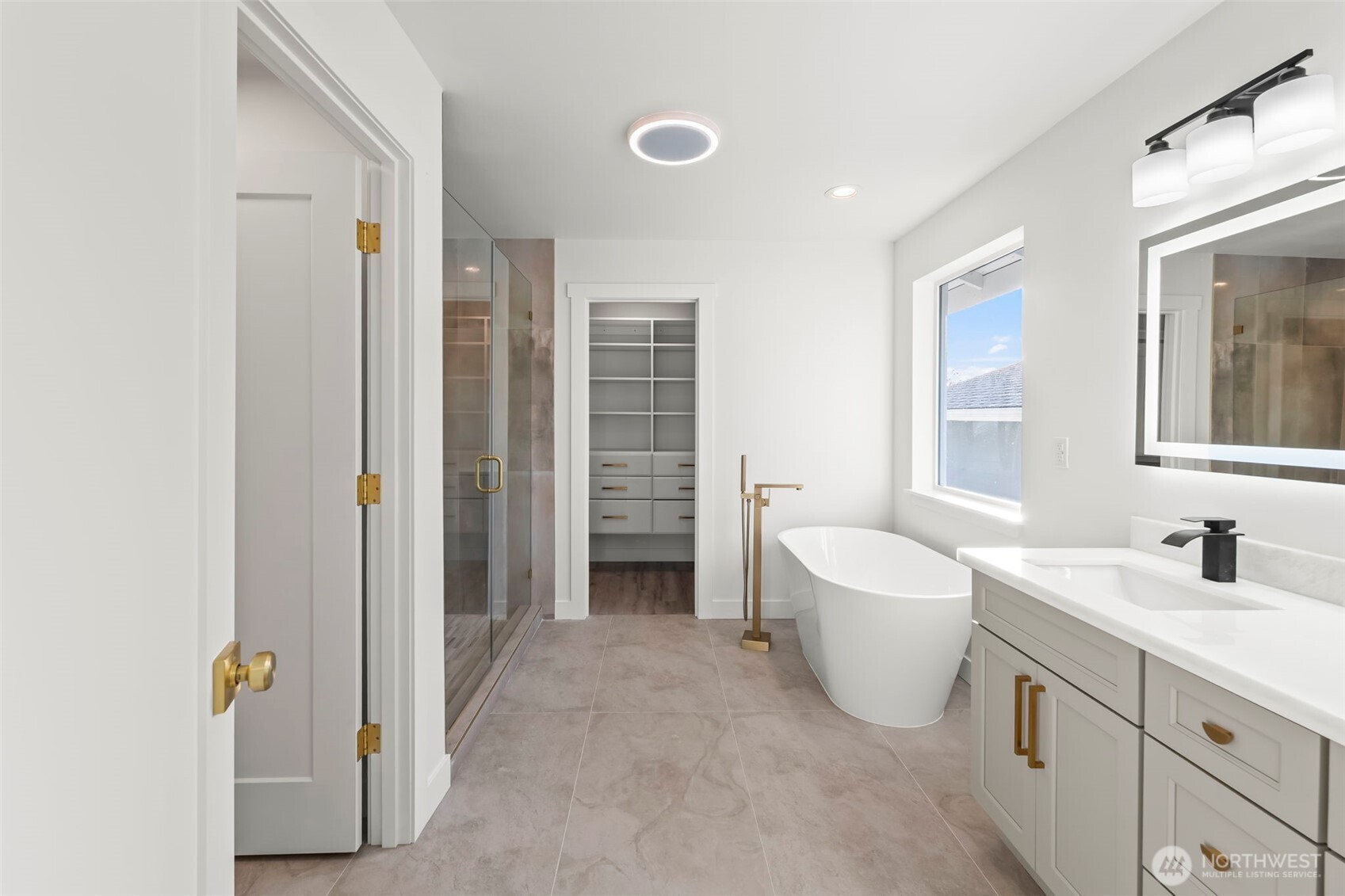 Primary bath showing the waterfall shower at right
