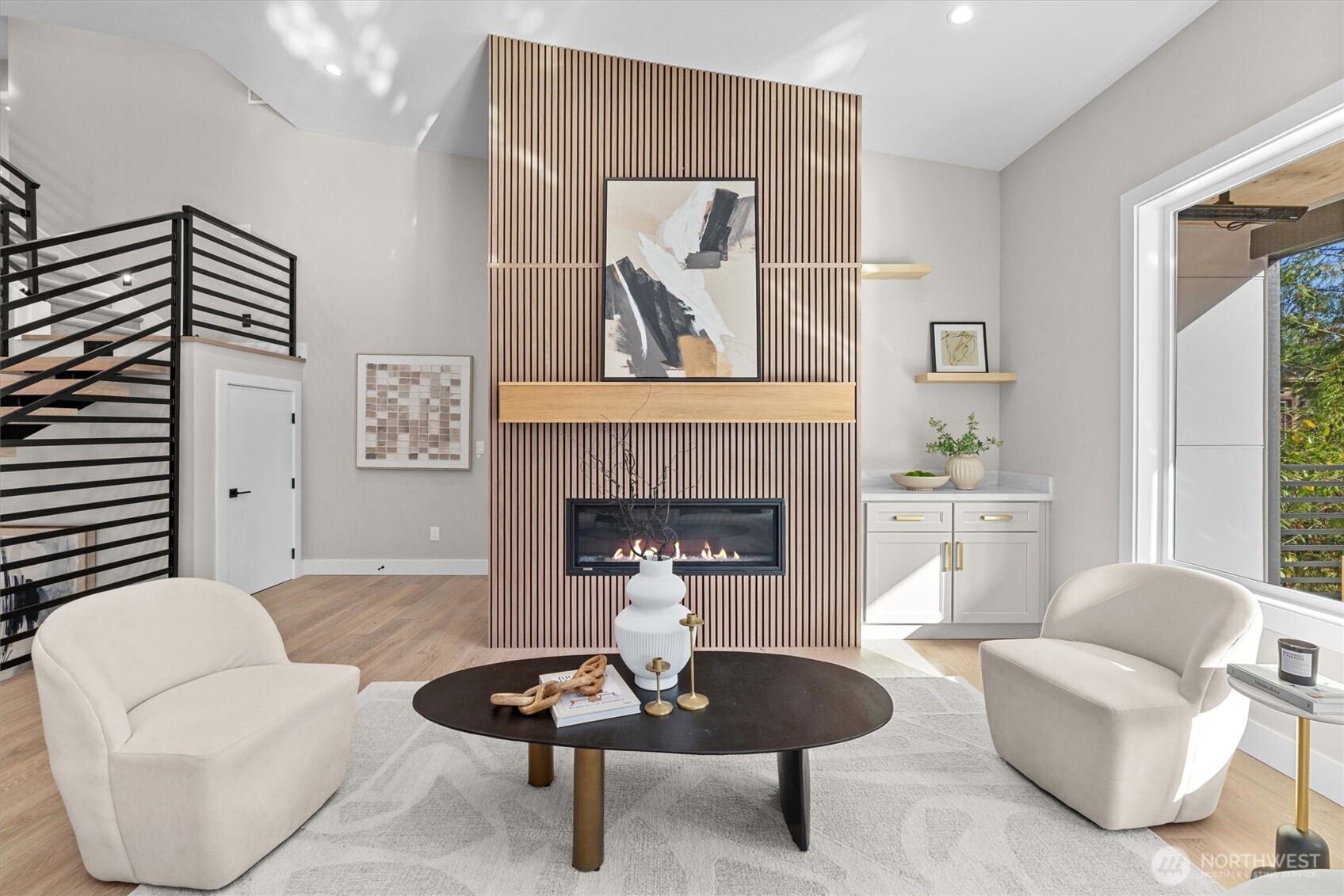 Open-concept great room with "statement" fireplace design