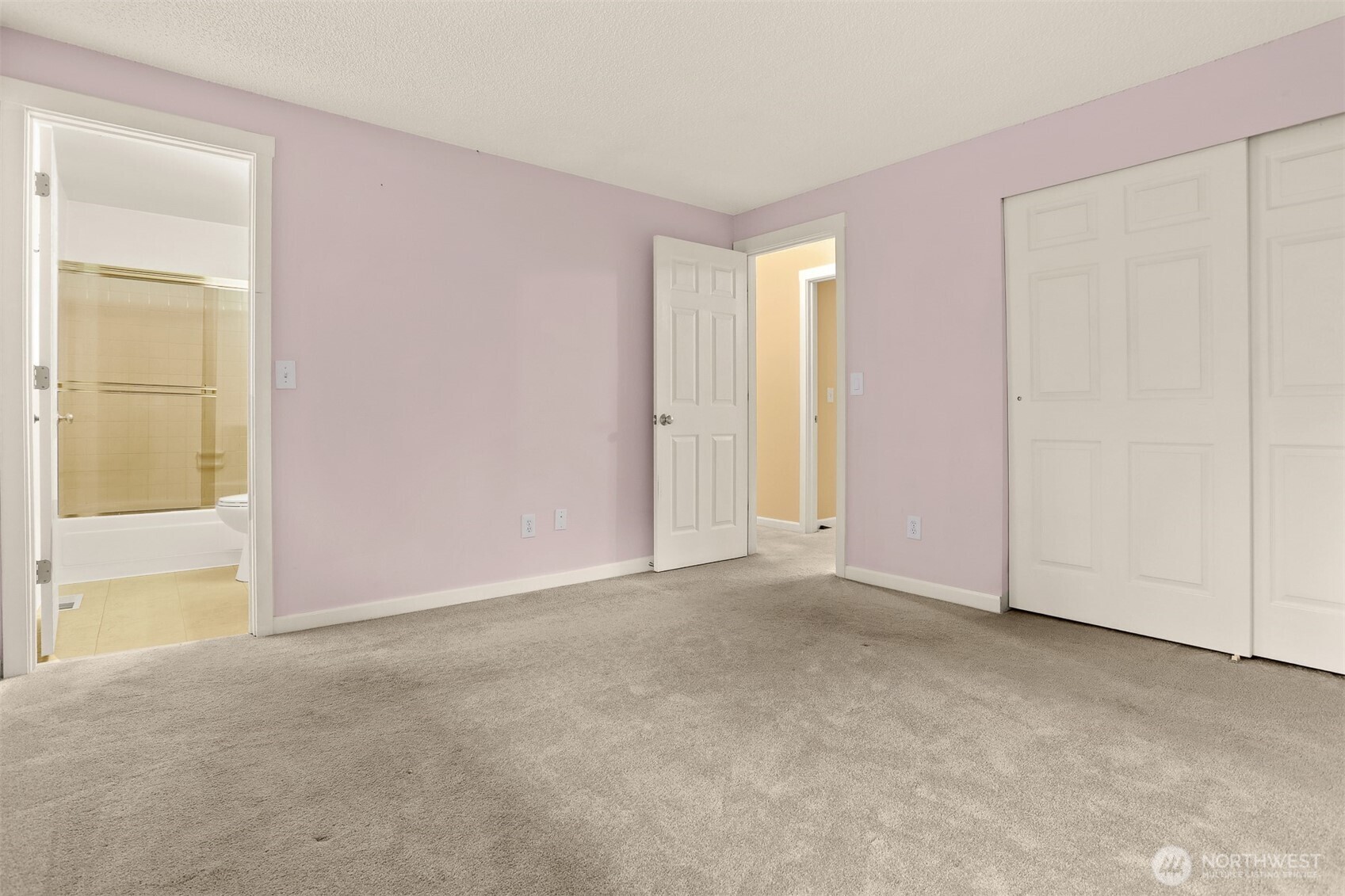 Primary bedroom including ensuite with full tub and shower