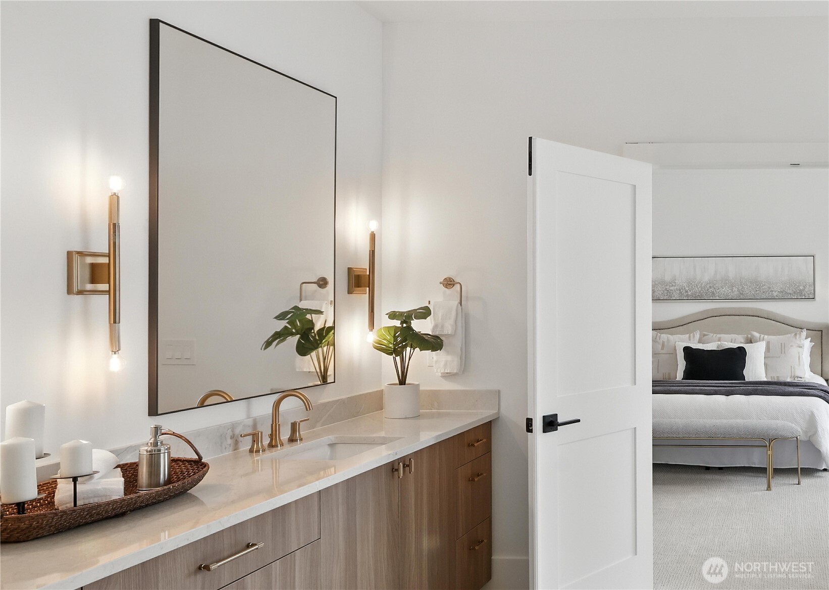 Spa-Inspired Bath: A statement in calm sophistication, the primary bath combines timeless design with modern indulgence. Dual vanities, brass-accent lighting, and a deep soaking tub invite relaxation, while the walk-in glass shower and broad picture window deliver a true spa-day atmosphere at home.  See today!