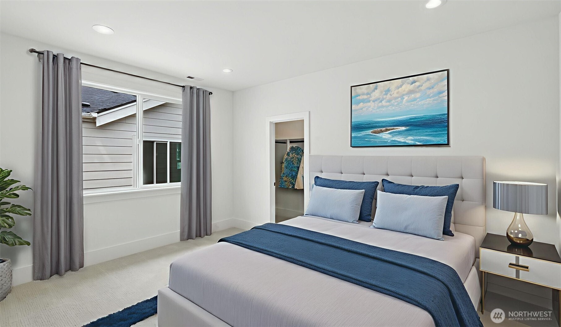 Spa-Inspired Bath: A statement in calm sophistication, the primary bath combines timeless design with modern indulgence. Dual vanities, brass-accent lighting, and a deep soaking tub invite relaxation, while the walk-in glass shower and broad picture window deliver a true spa-day atmosphere at home.