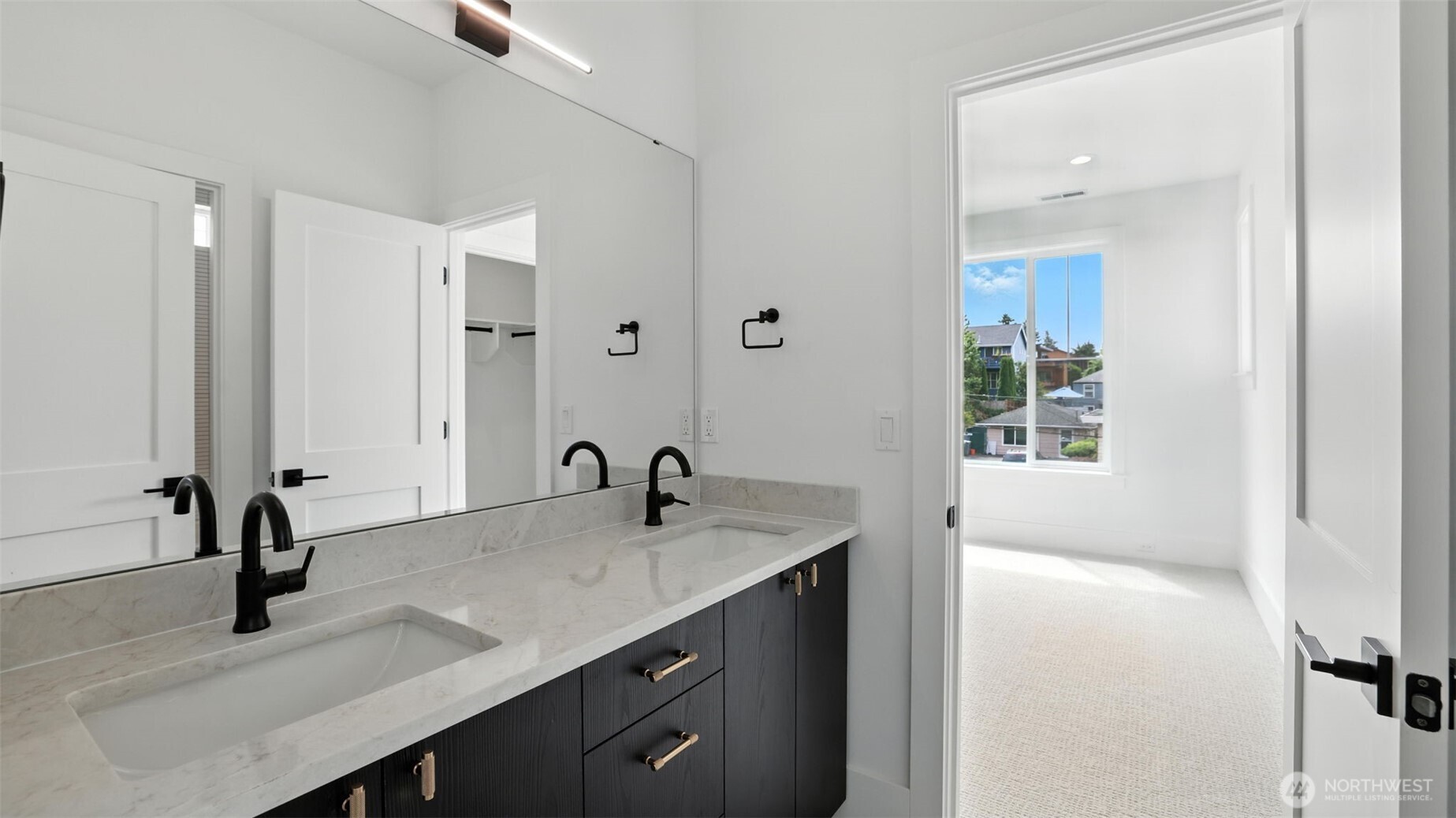 Main Level Guest Suite:  The main-level guest suite offers privacy and convenience as well as an attached private bathroom - ideal for multi-generational living or long-term visitors.