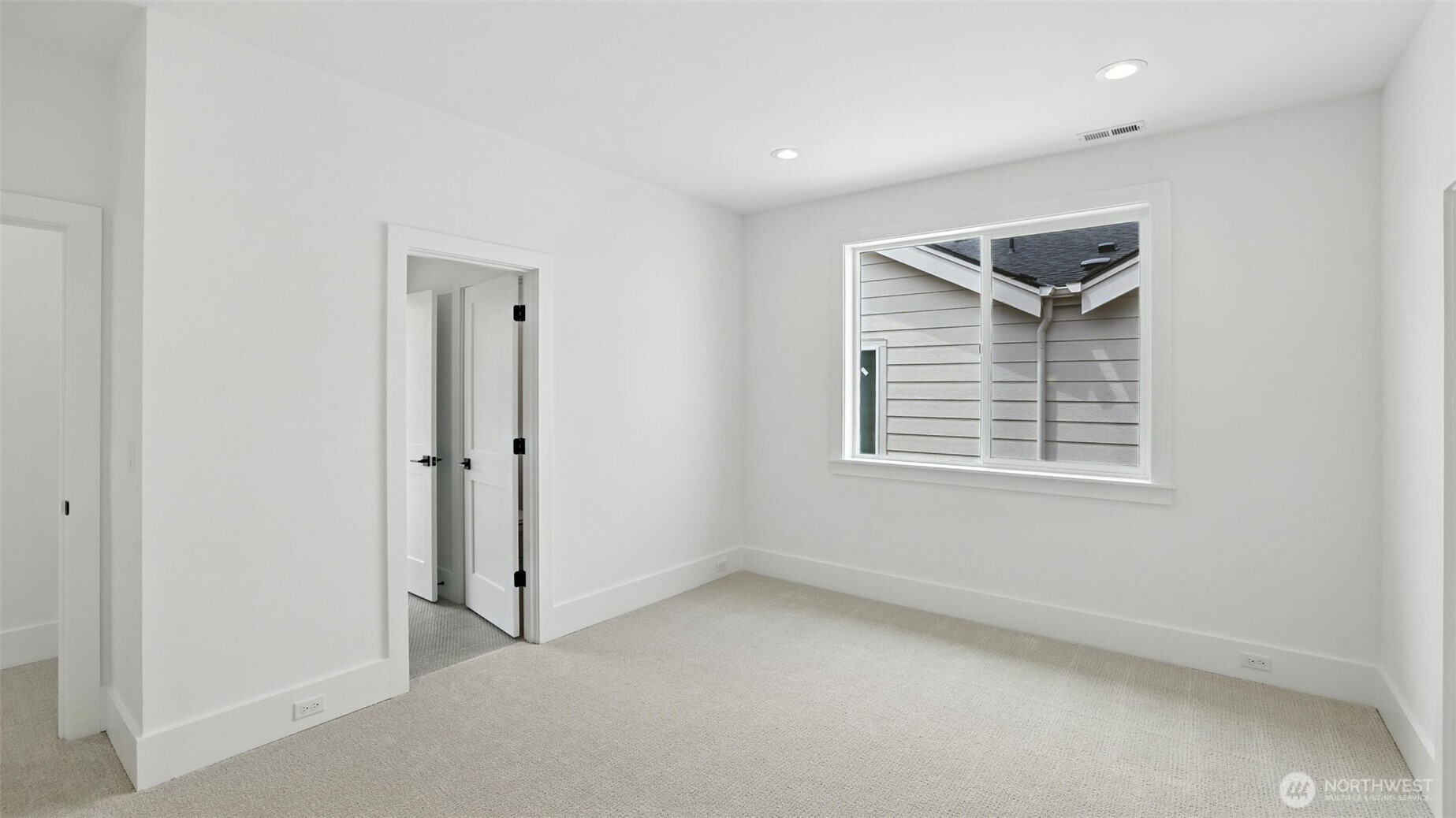 Each secondary bedroom continues the home’s bright, serene aesthetic, pairing clean architectural lines with soft textures and spacious closets — a thoughtful balance of comfort and design continuity.