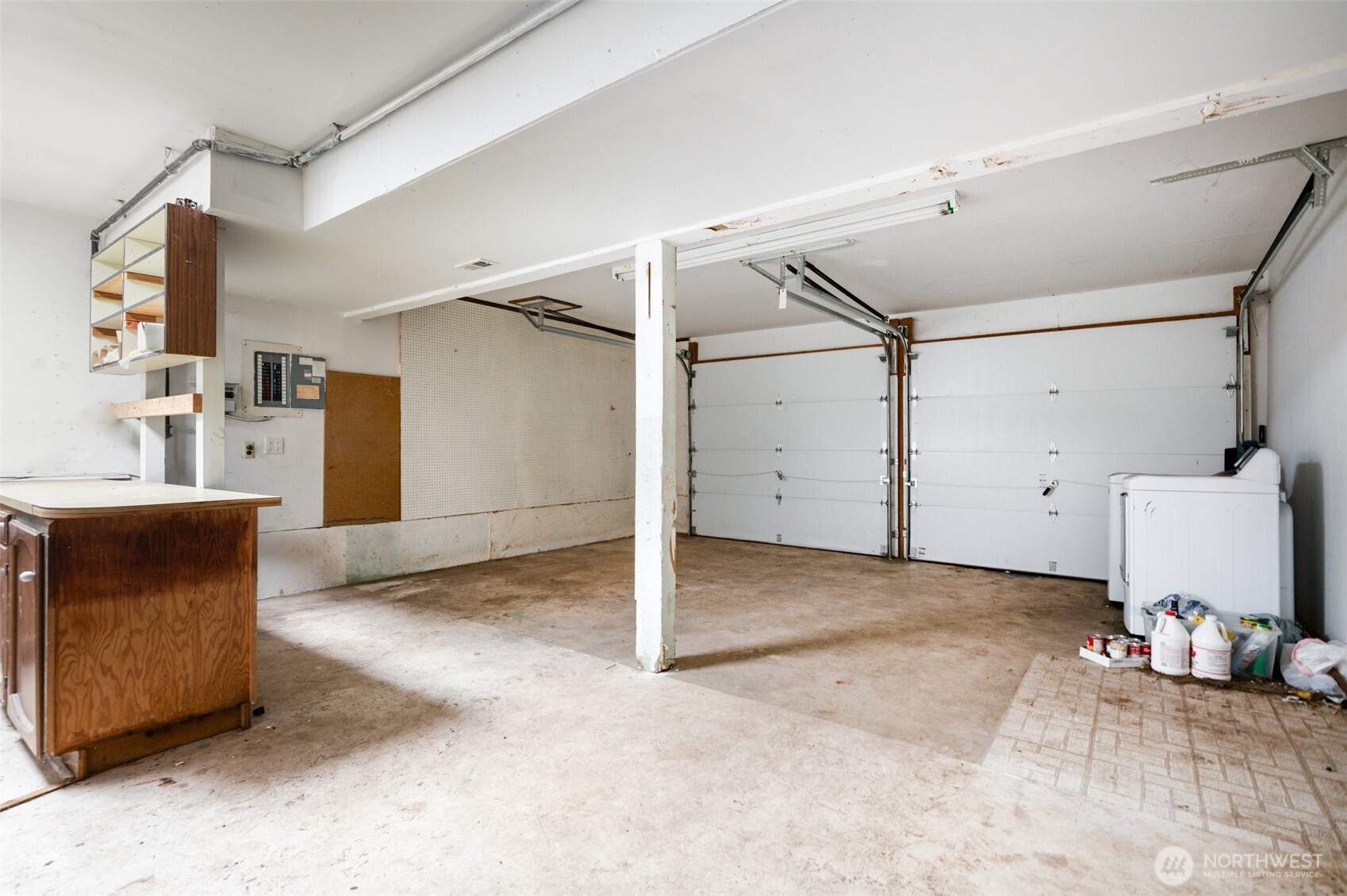 The spacious two-car garage provides ample room for vehicles, tools, and storage, with easy access directly into the home for everyday convenience.