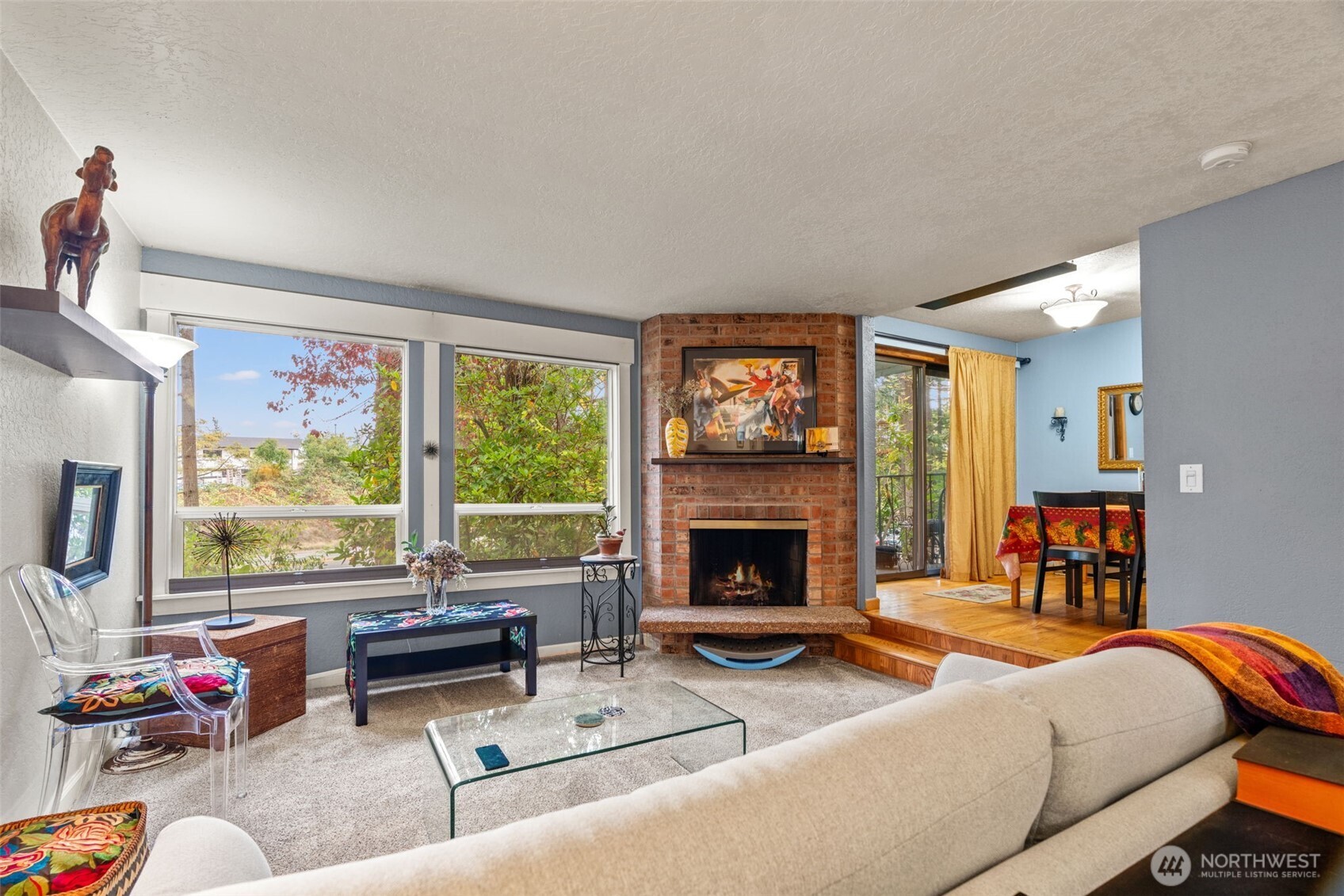 Open living room with fireplace.