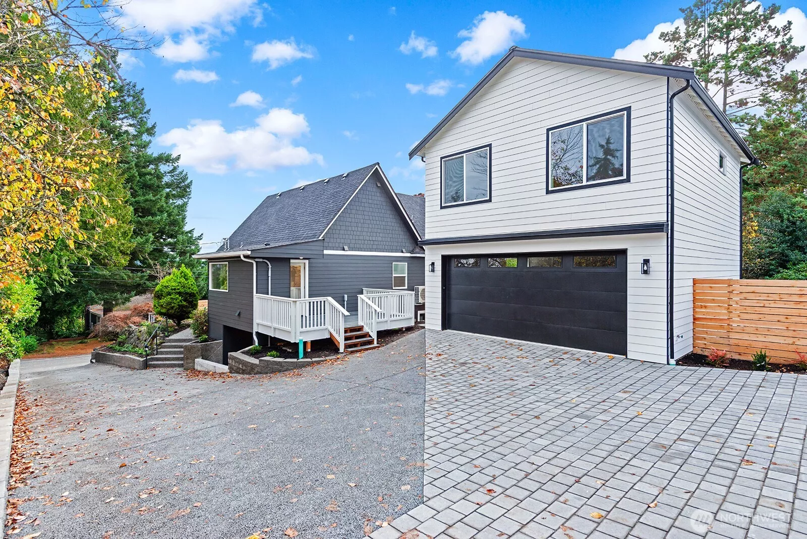 Detached garage with studio apartment above plus a fully remodeled Craftsman!