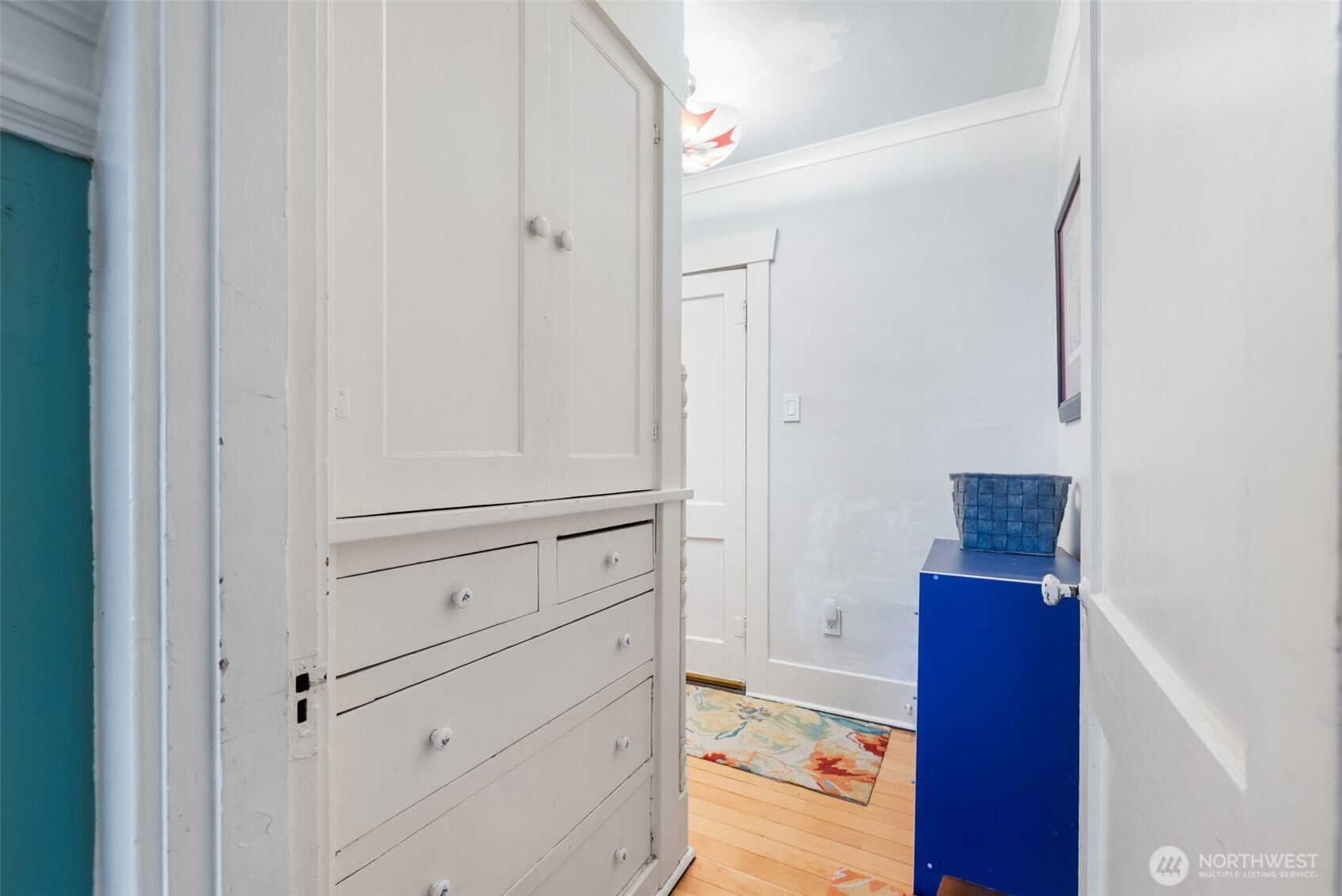Connected to the Dining room, a hallway leads to the main floor bathroom, bedroom and stairs to the second floor