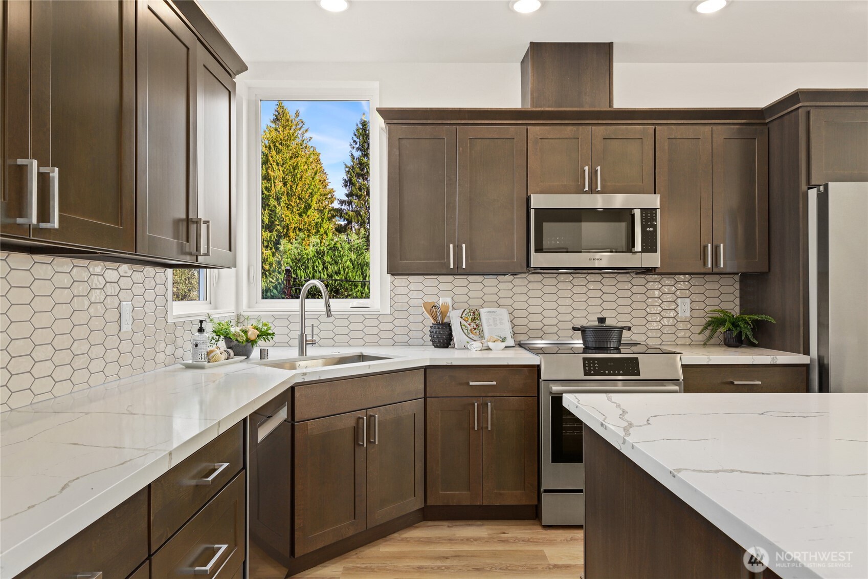 Modern kitchen with large island and Bosch Appliances.