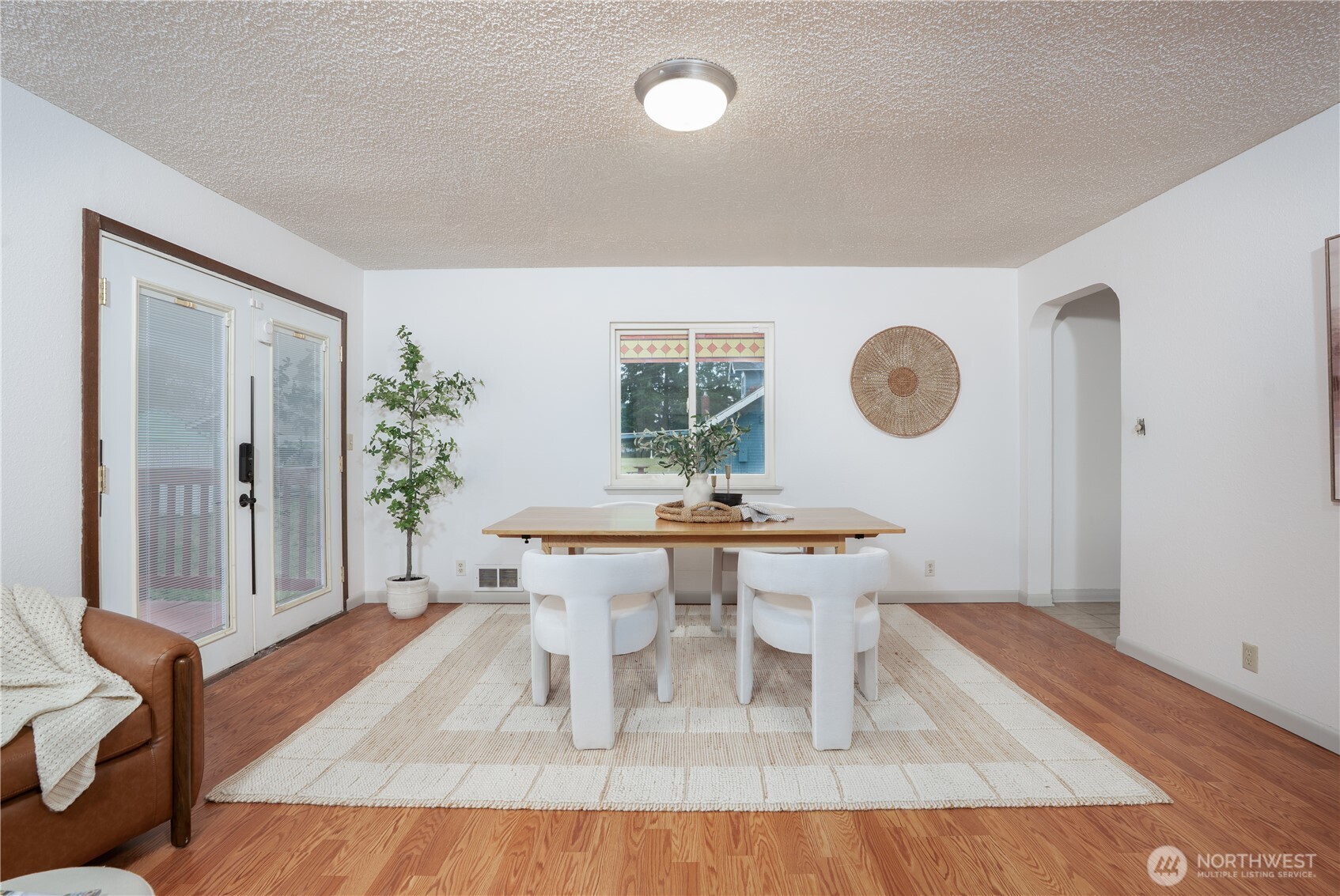 French doors open to the back deck and yard.