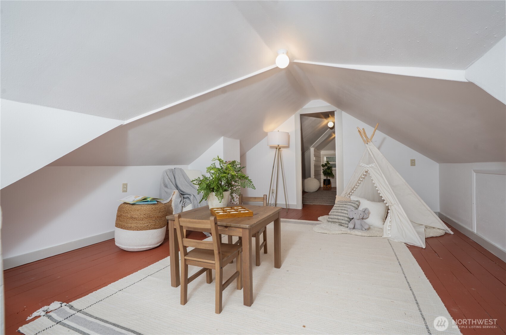 The upstairs offers additional versatile space, perfect for a guest room, home office, or cozy hangout area.