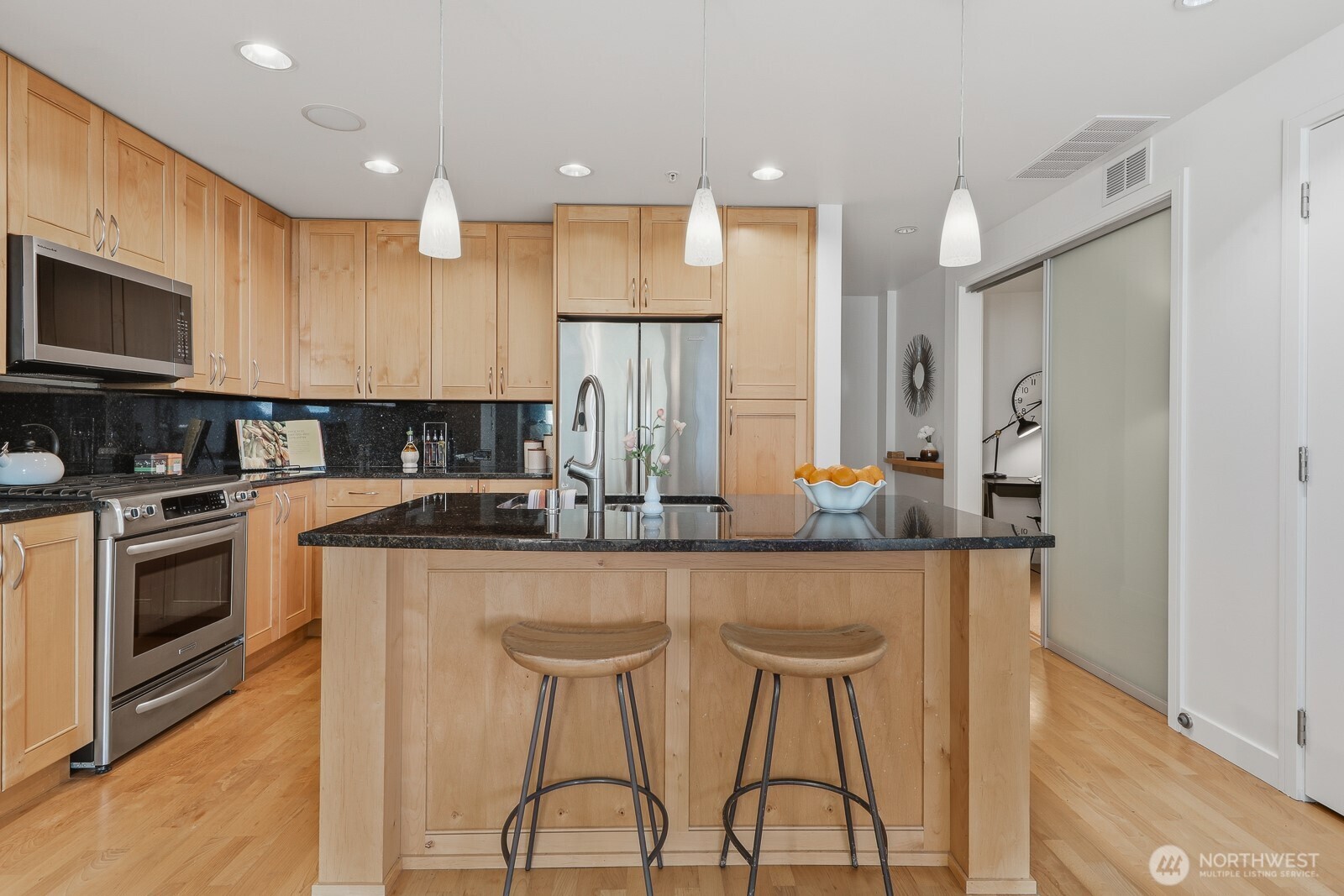 Open Concept Kitchen: Designed for entertaining with a large island. The island bar allows guests to gather and observe cooking demonstrations.