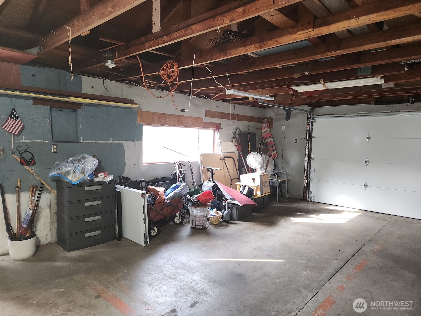 Plenty of light coming in through the windows to the garage, but it also has light above.