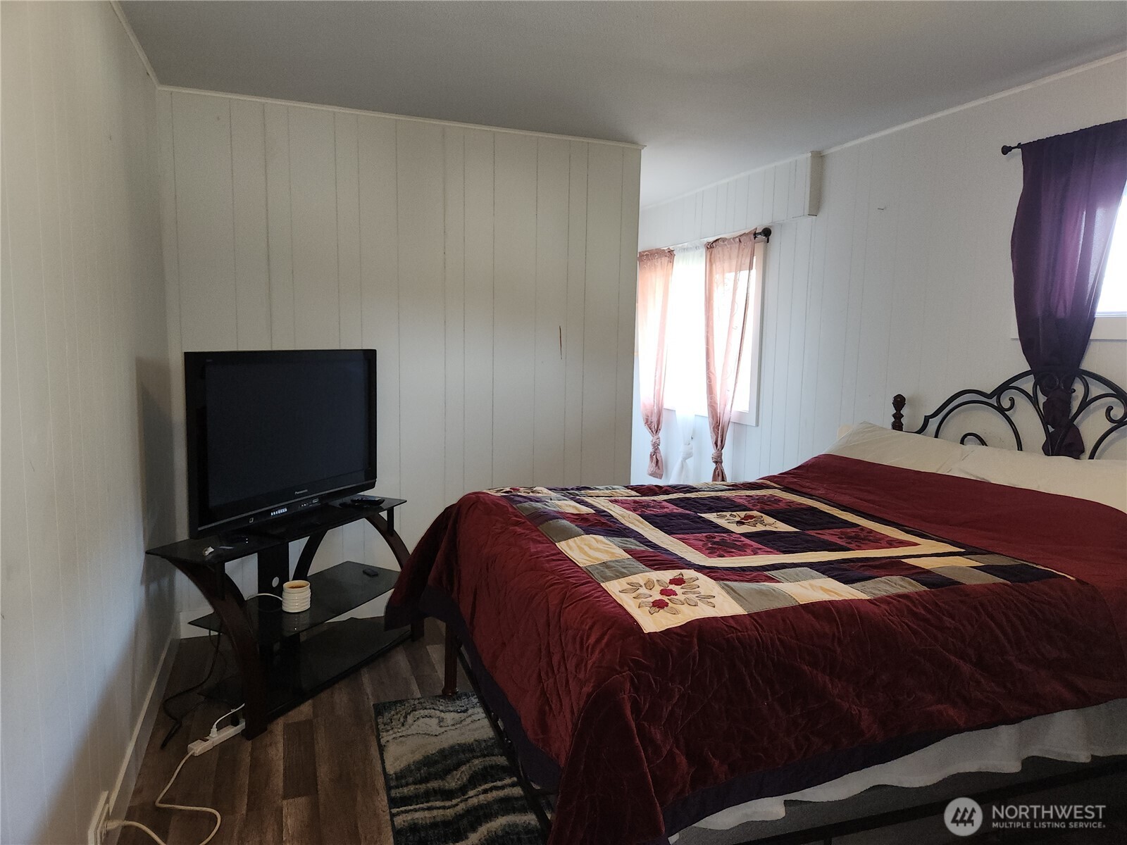 Larger of the two bedrooms downstairs.