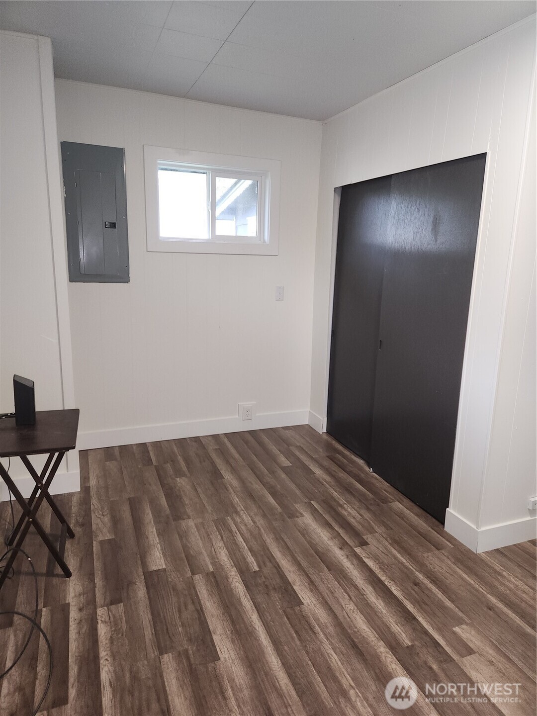 Between the two rooms downstairs is this beautiful bathroom with beautiful tiled flooring and shower.