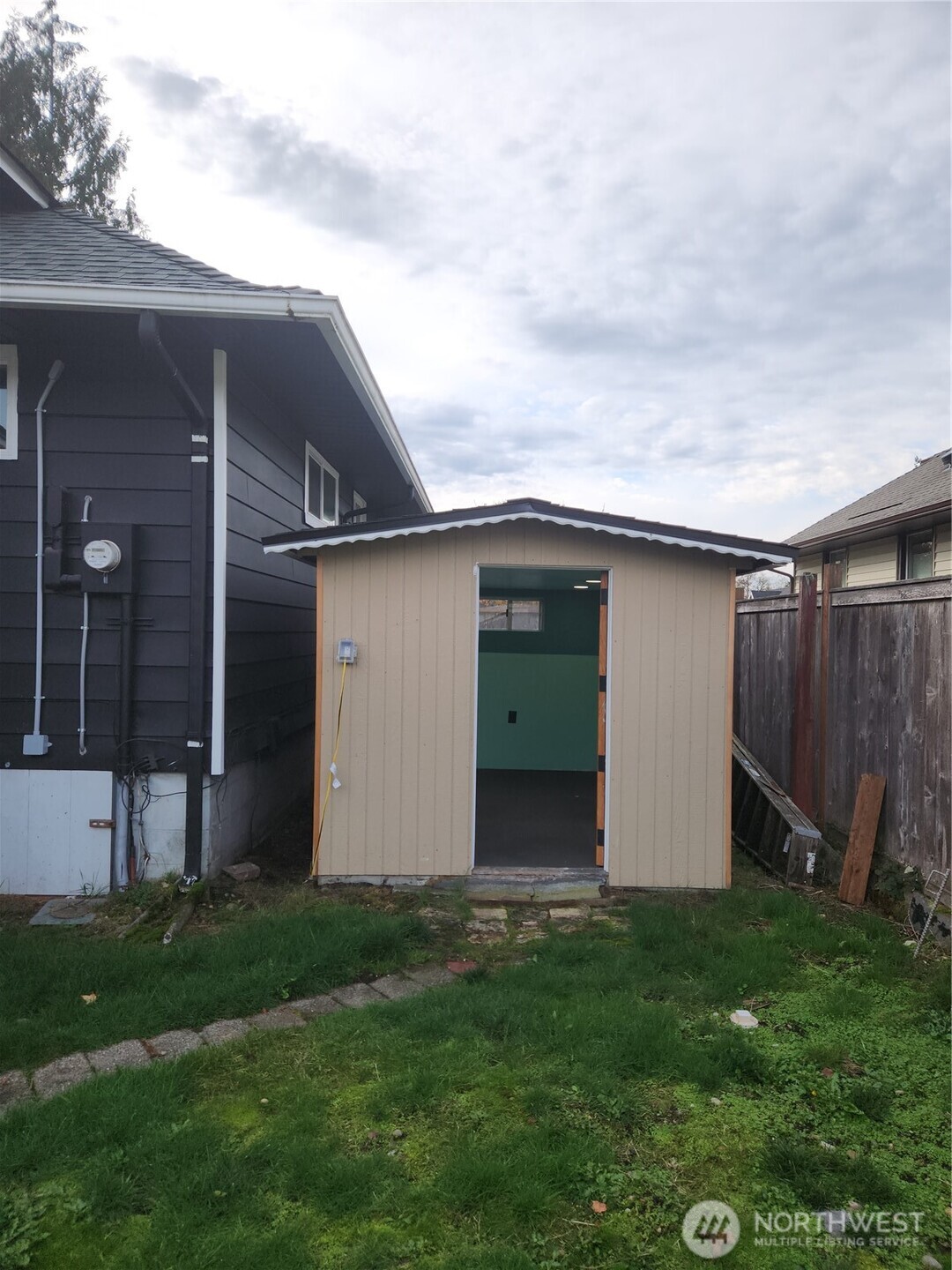 Shed off to the home, sheetrocked and electricity