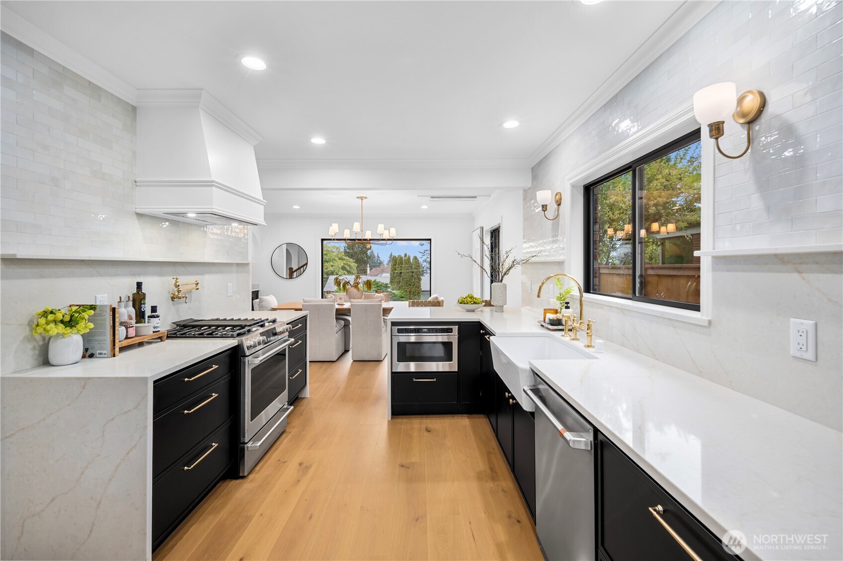 Another view of the kitchen - you will LOVE the brushed gold pot filler above the gas range!