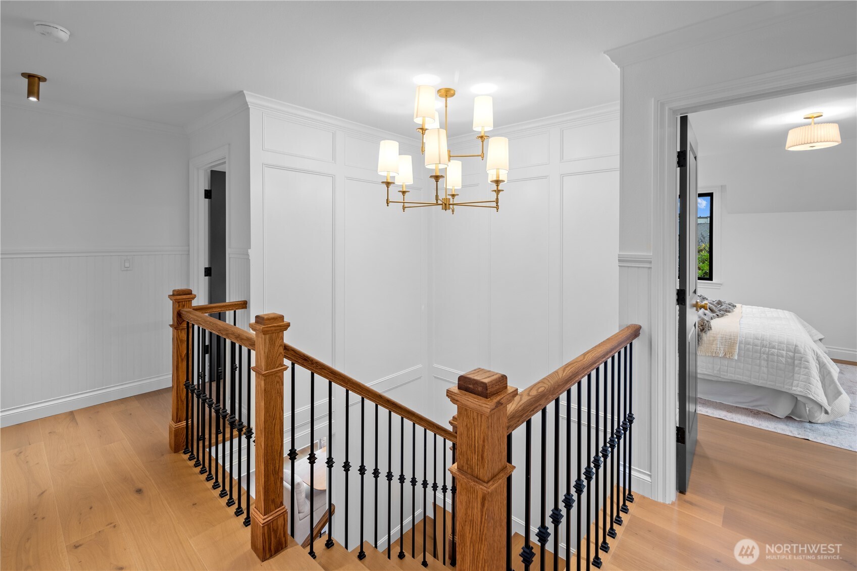 Custom stairway and fixture leading to 3 upstairs bedrooms including the Primary en suite and attic retreat!