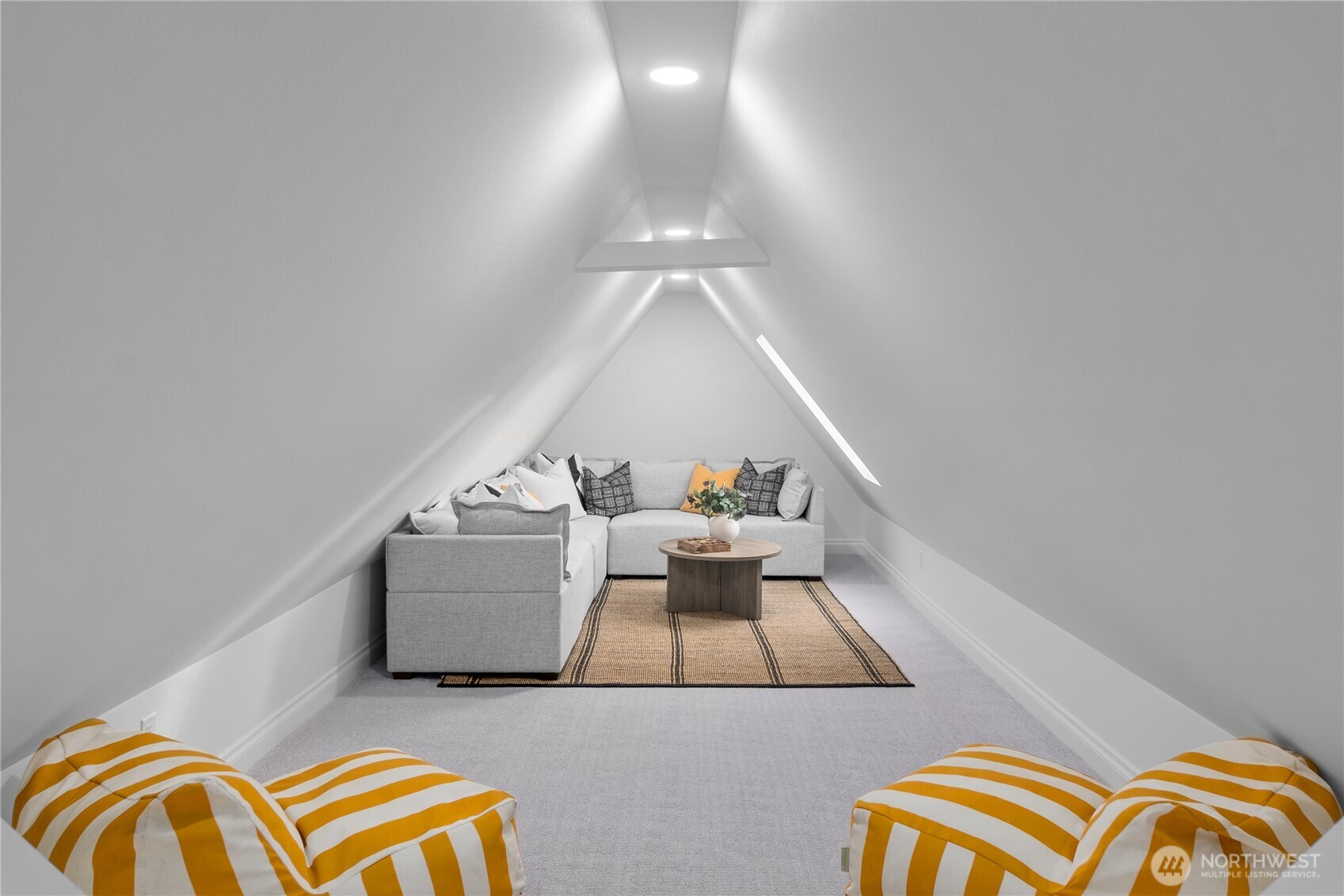 Completely finished and a bit whimsical attic space. It's much larger than captured here - approximately 500 square feet (not included in the home square footage). It's a prefect place to play, relax or even as an office space..