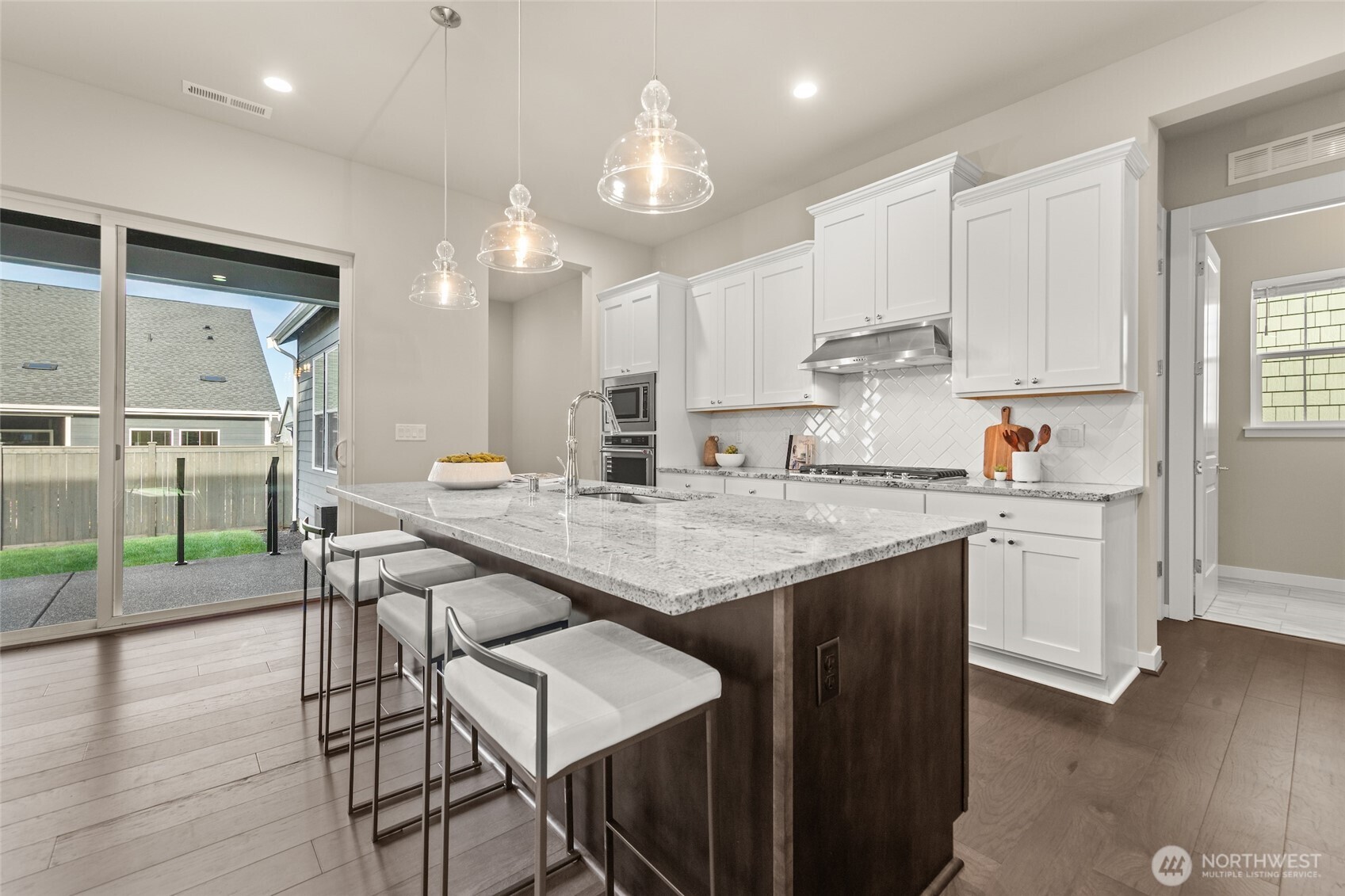 Stunning countertops and custom soft-close cabinetry offer both beauty and function.