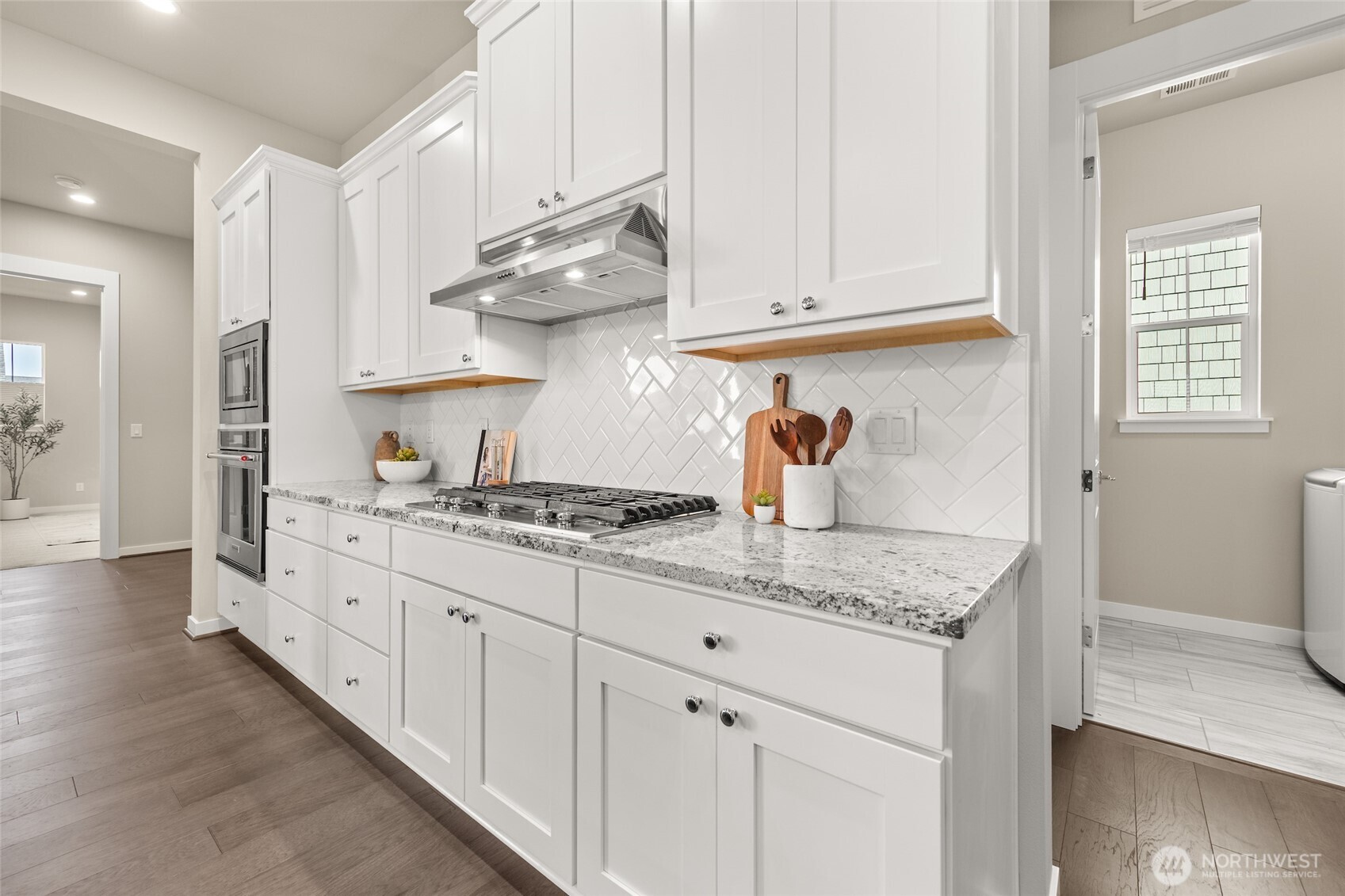 Every detail has been upgraded — hardwood, lighting, and soft-close everything.