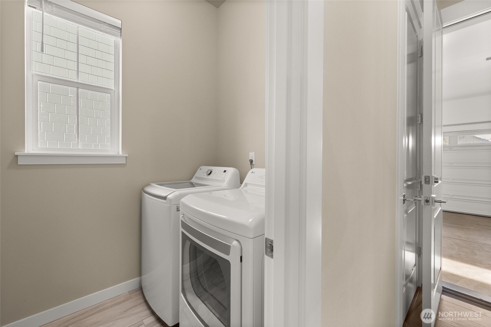 Dedicated laundry space with plenty of room to fold and organize.