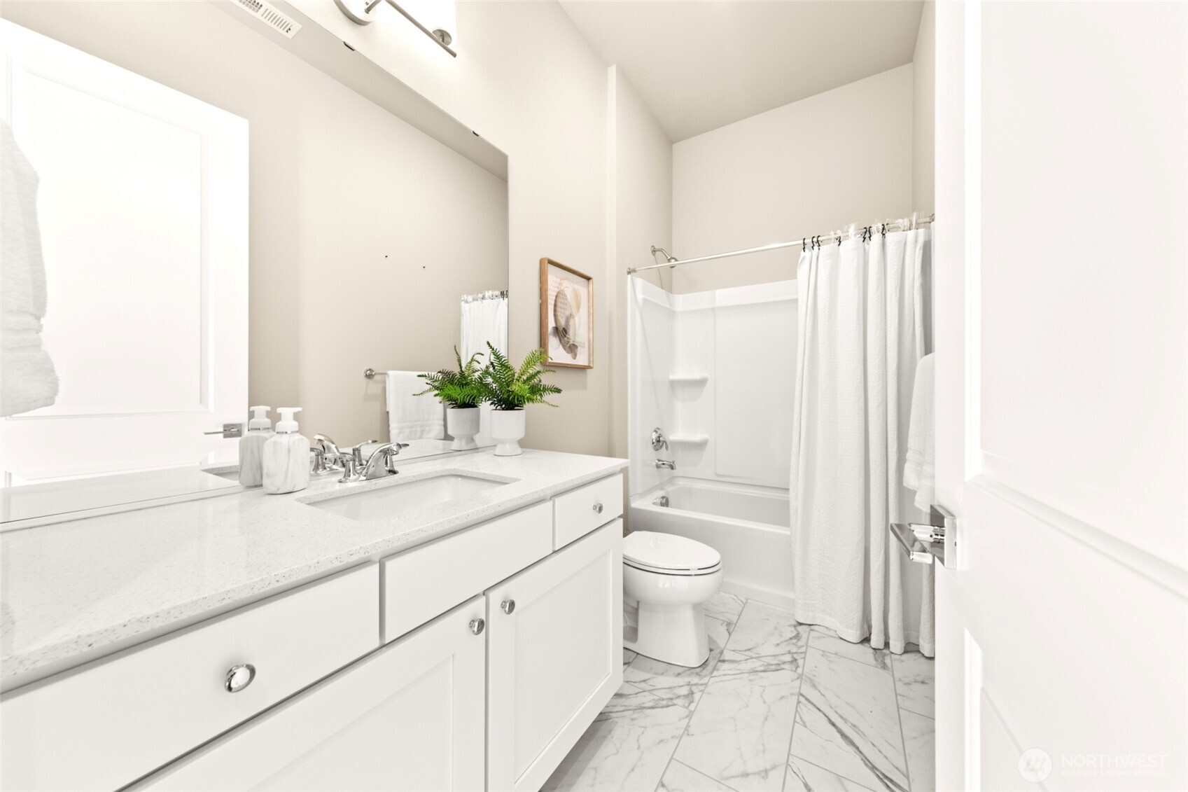 Full second bath with contemporary finishes.