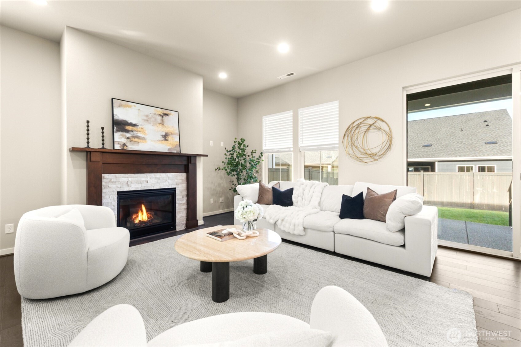 Cozy up by the gas fireplace in this stylish, open-concept living area.