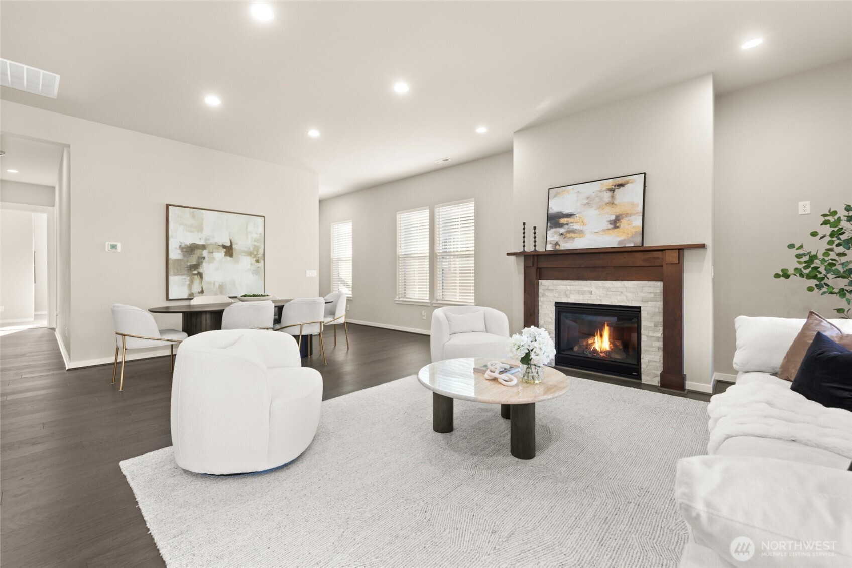 Cozy up by the gas fireplace in this stylish, open-concept living area.