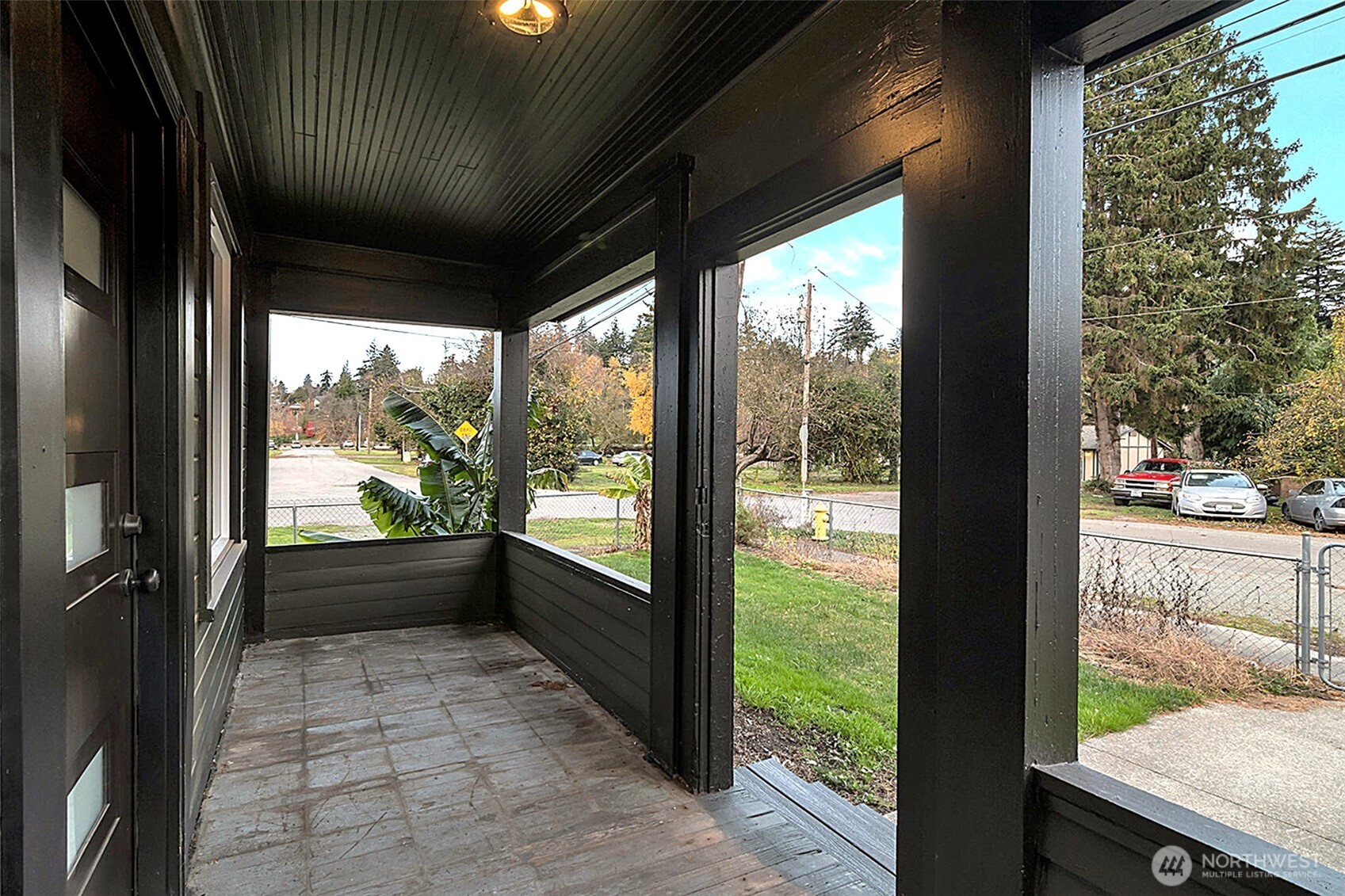 Covered front porch, new front doorway and lighting.