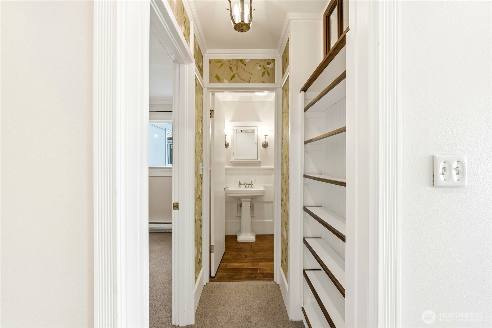 Thoughtful built-ins and charming lighting enhance this inviting hallway.