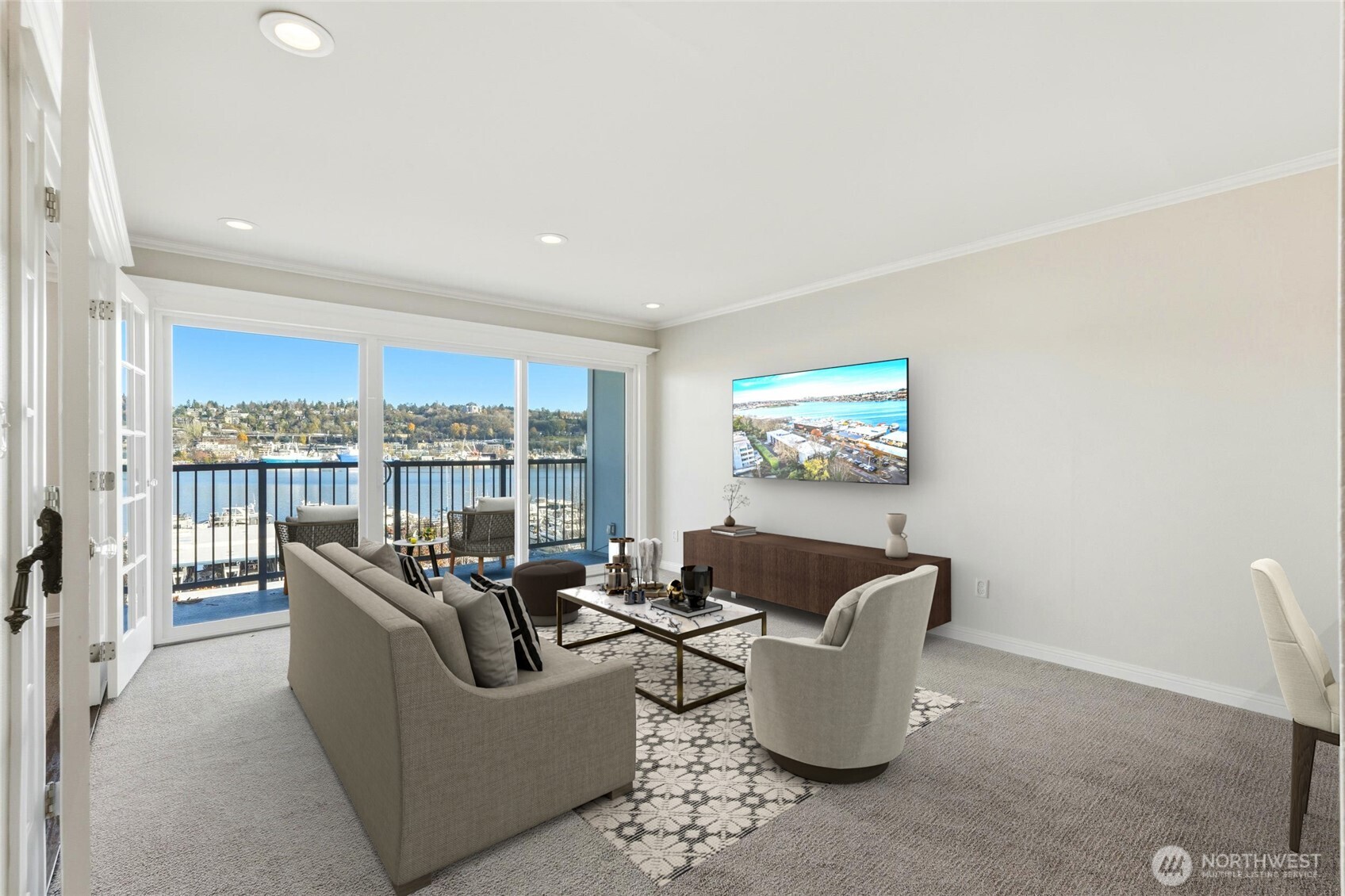 Wall of windows fills the space with natural light and panoramic lakefront views.