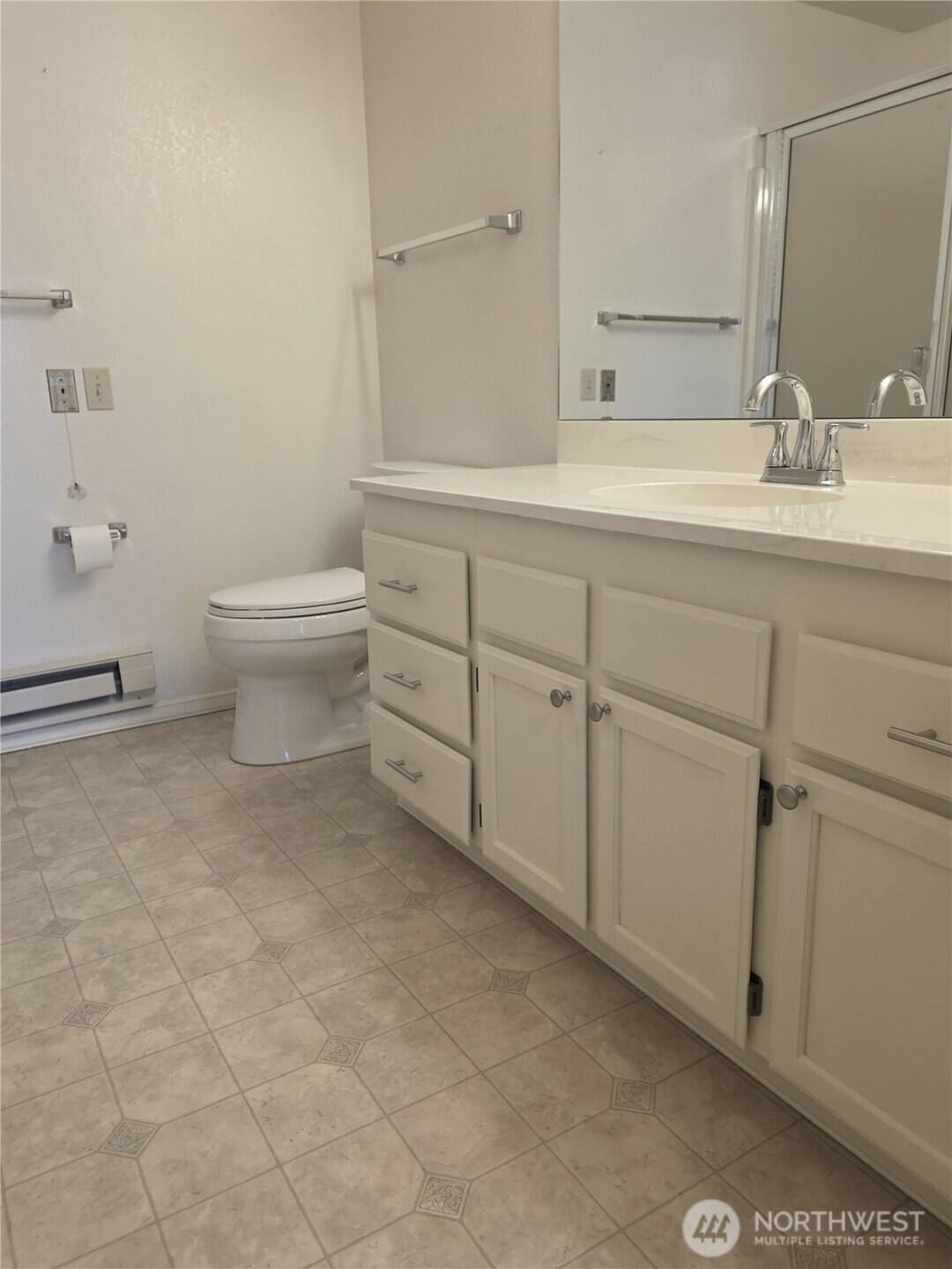 Primary bathroom.  Closets are on either side of the hallway to this bath.