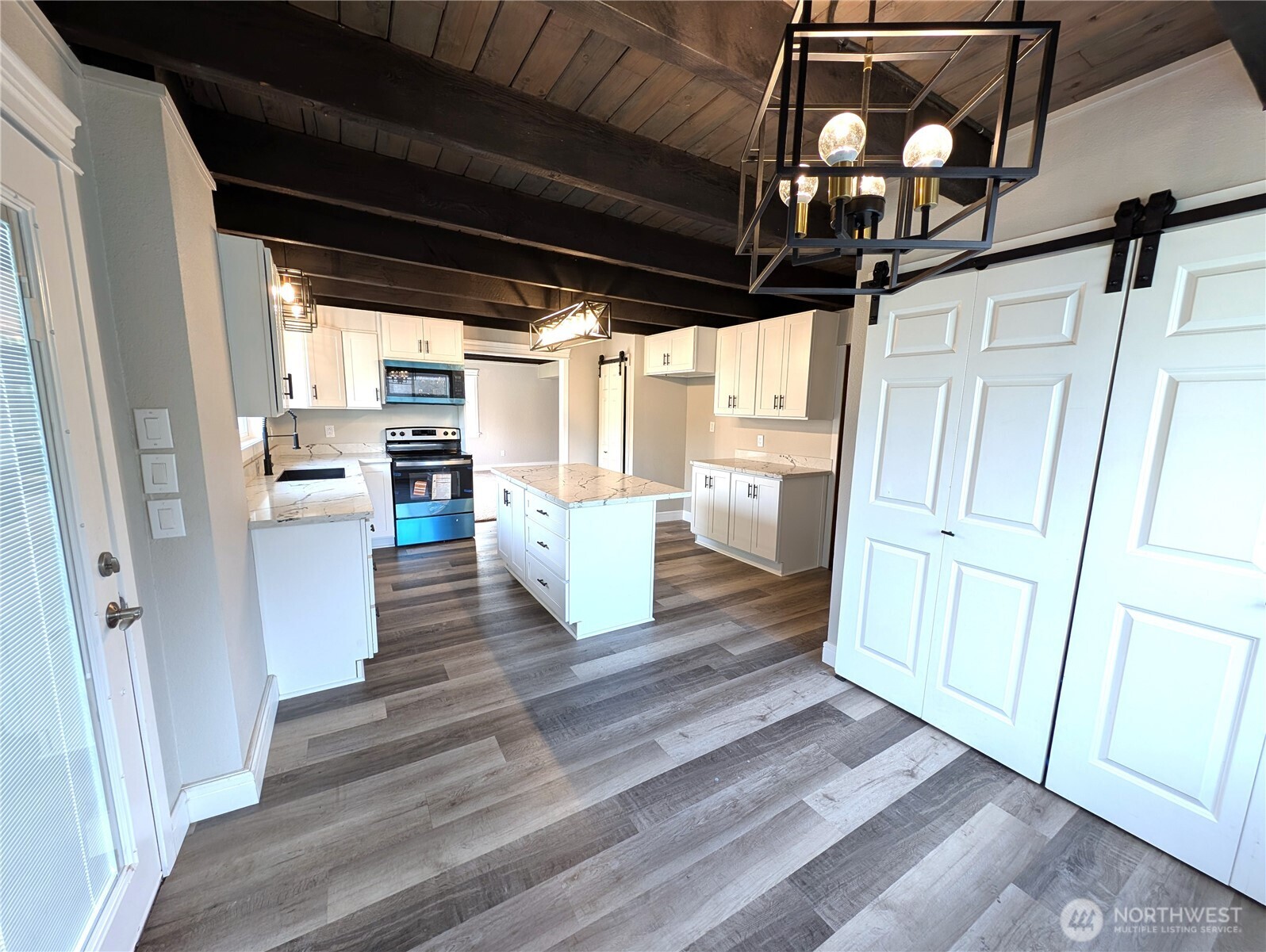New cabinets, quartz counters, new trim, flooring & light fixtures.